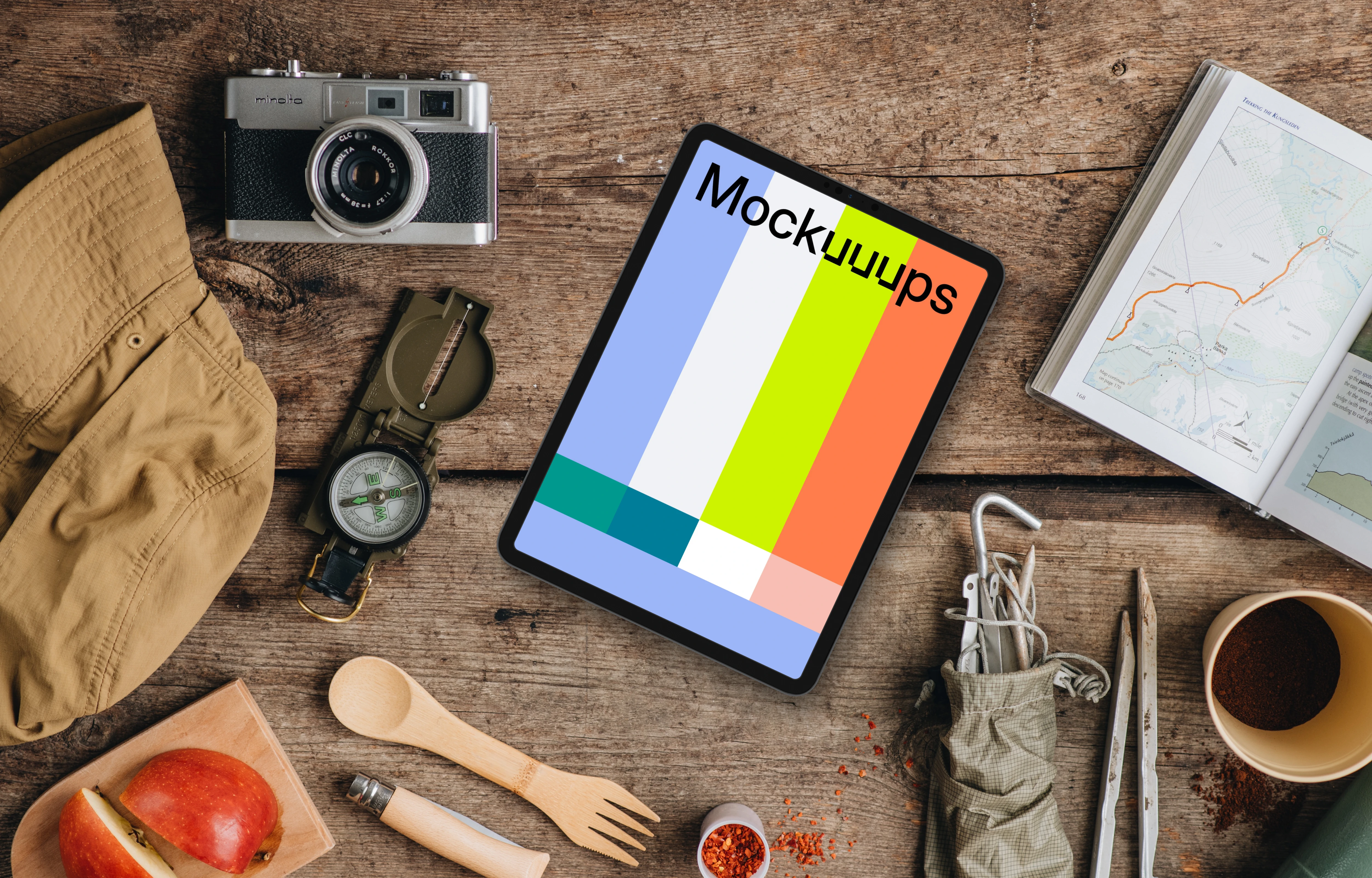 Hiking trip supplies around tablet mockup