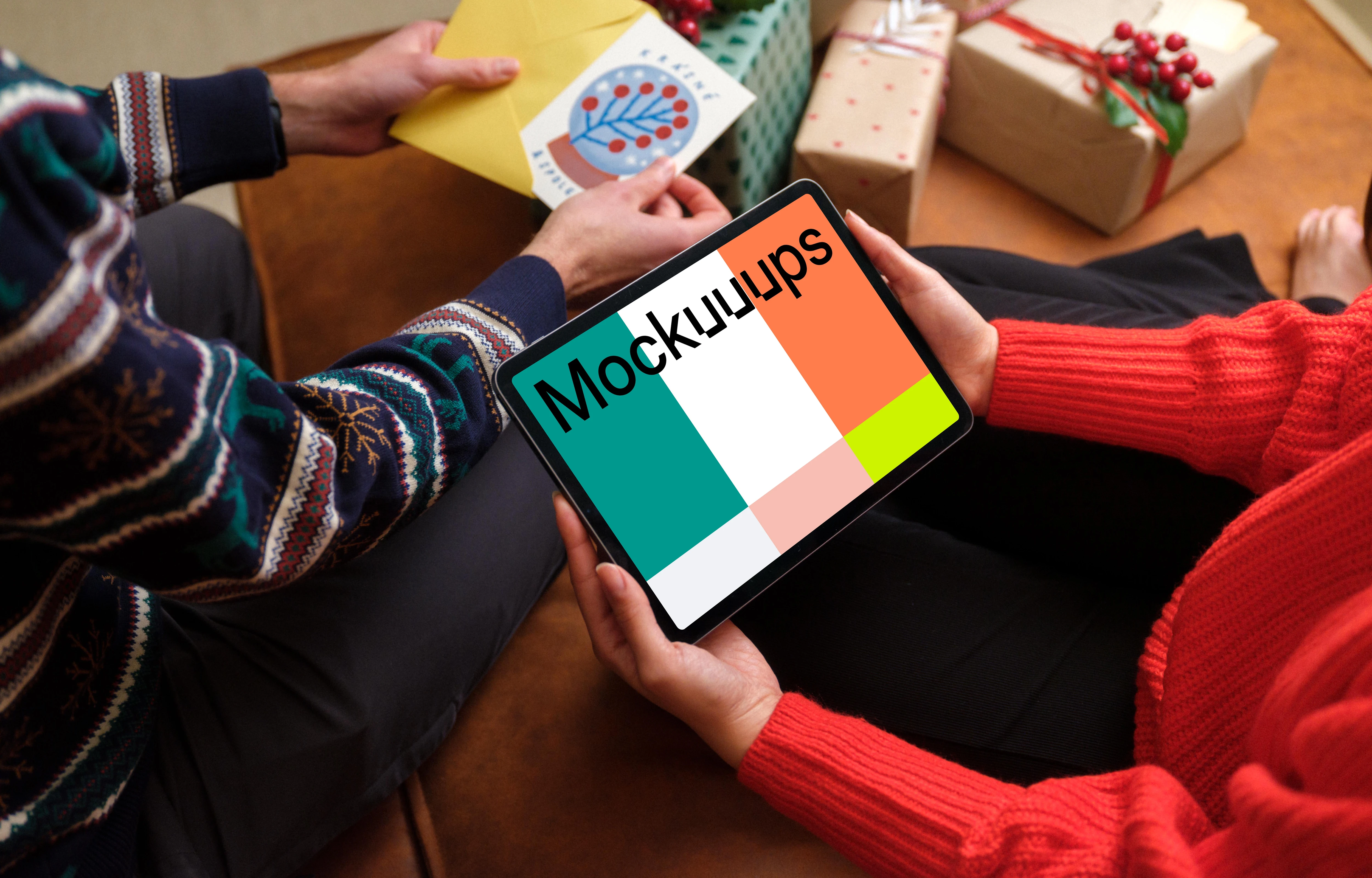 Holding iPad mockup and unpacking Christmas presents