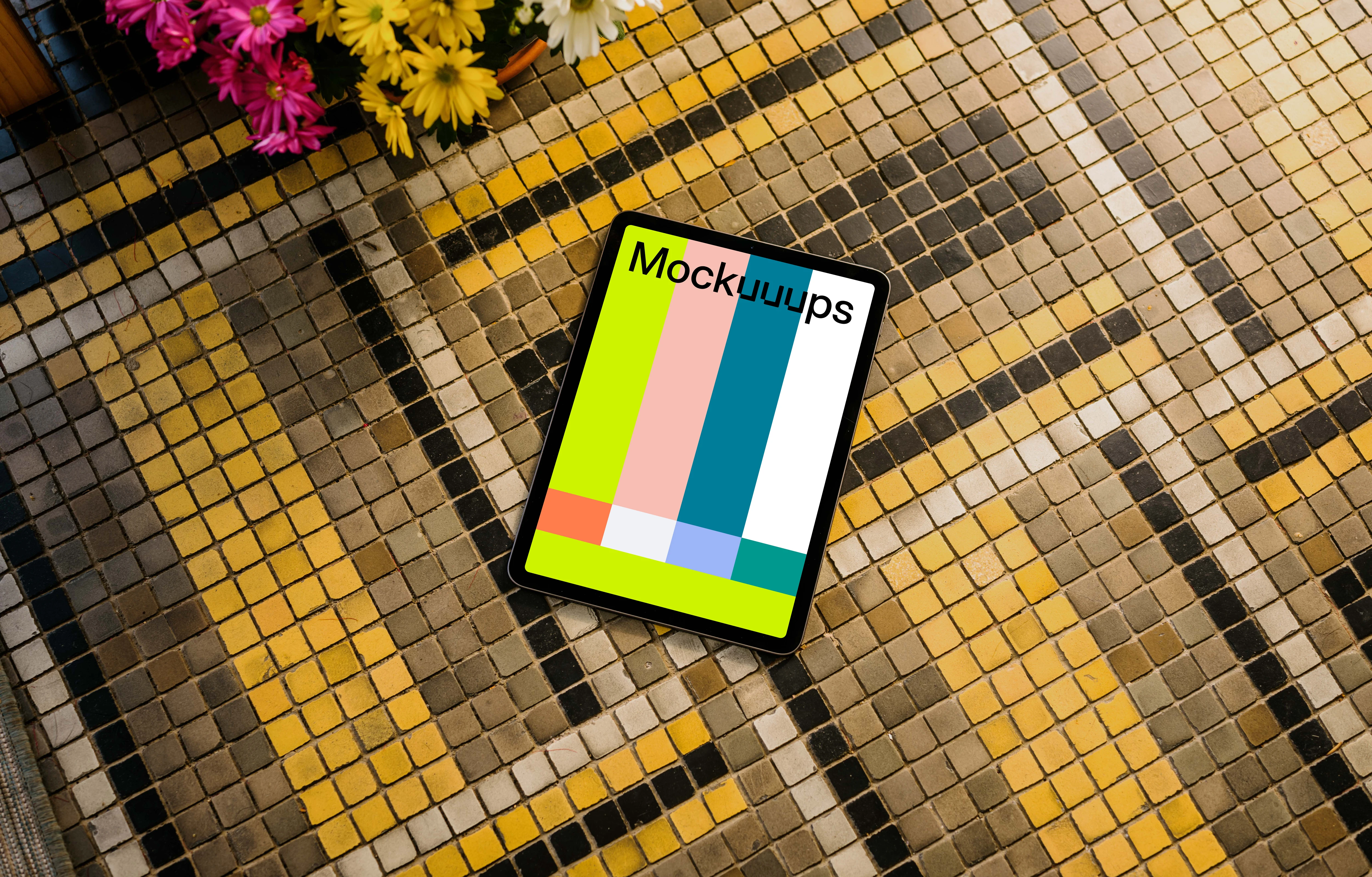 iPad Air mockup on a colorful garden paving with flowers