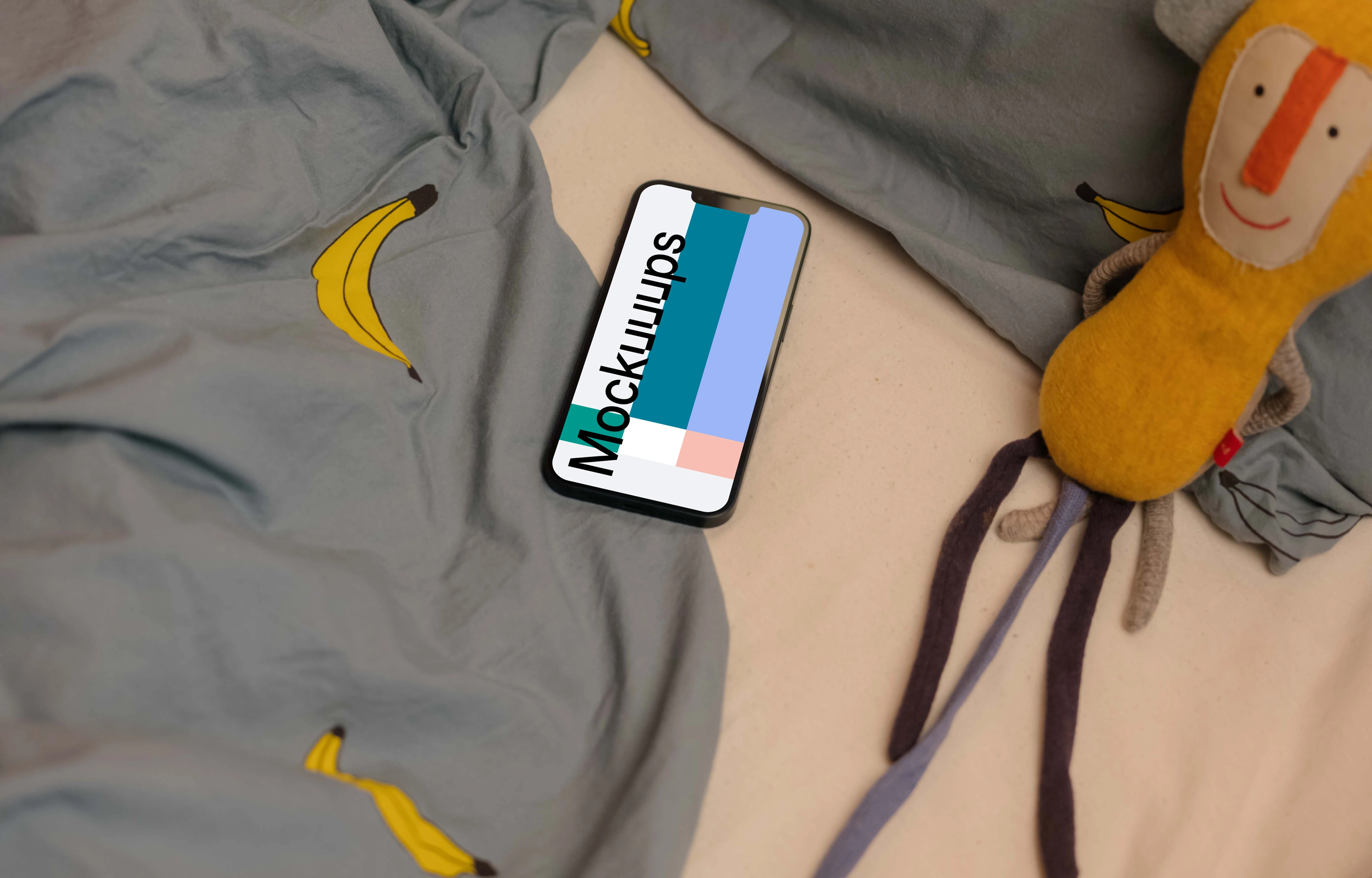 iPhone 13 mockup with stuffed animals