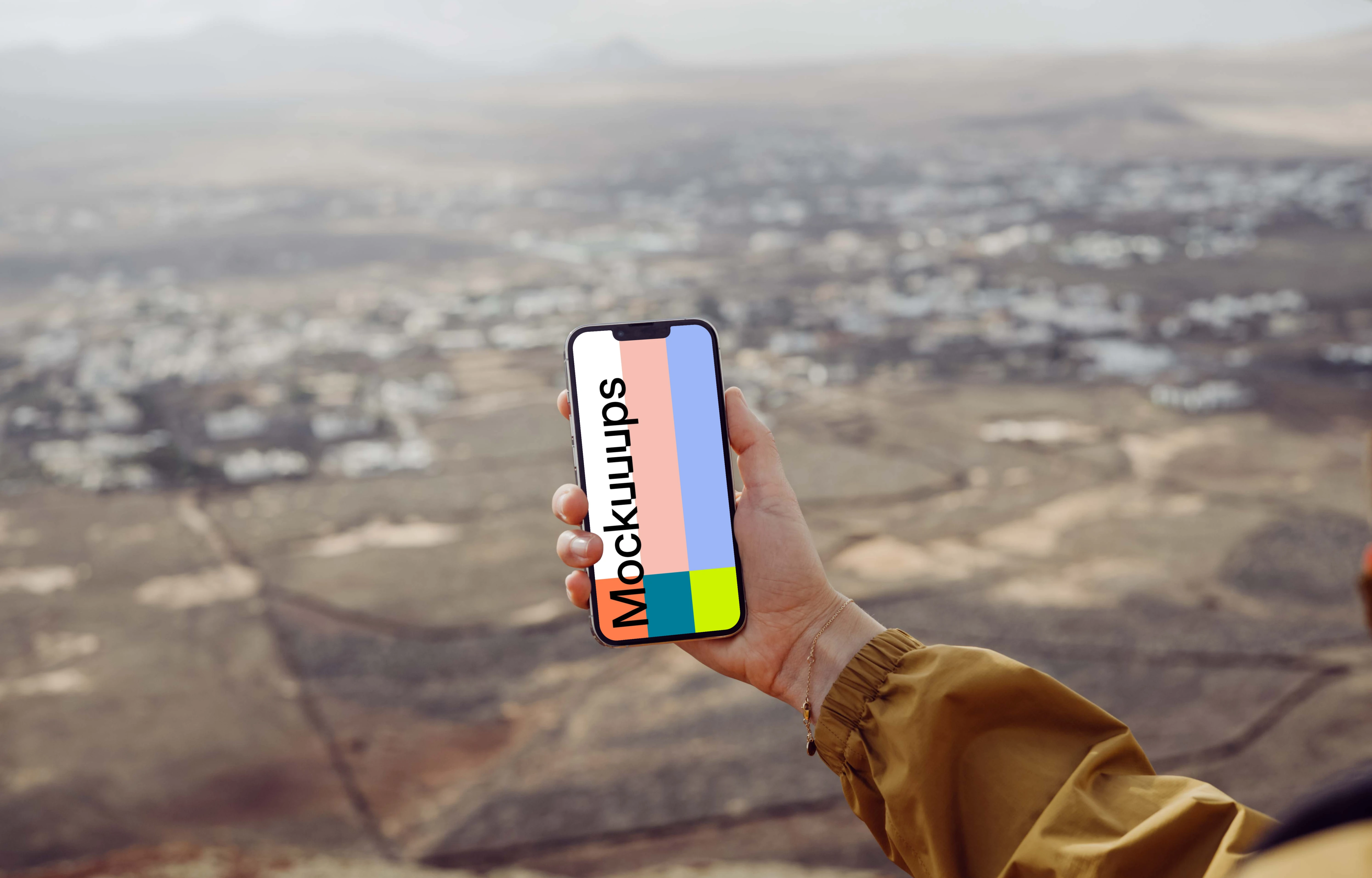 iPhone 13 Pro mockup held by a user above a field