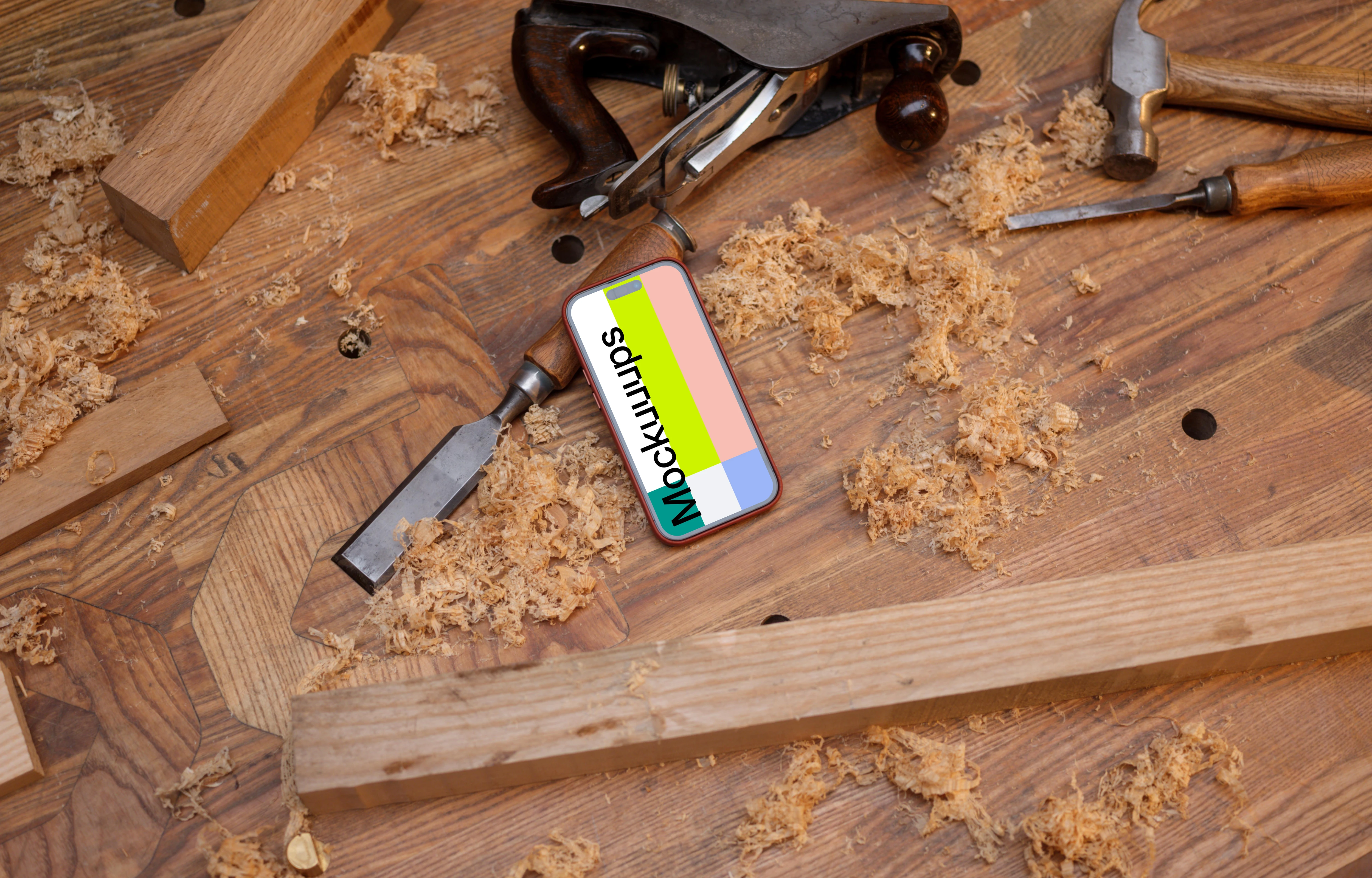 iPhone 14 Pro surrounded by carpentry tools
