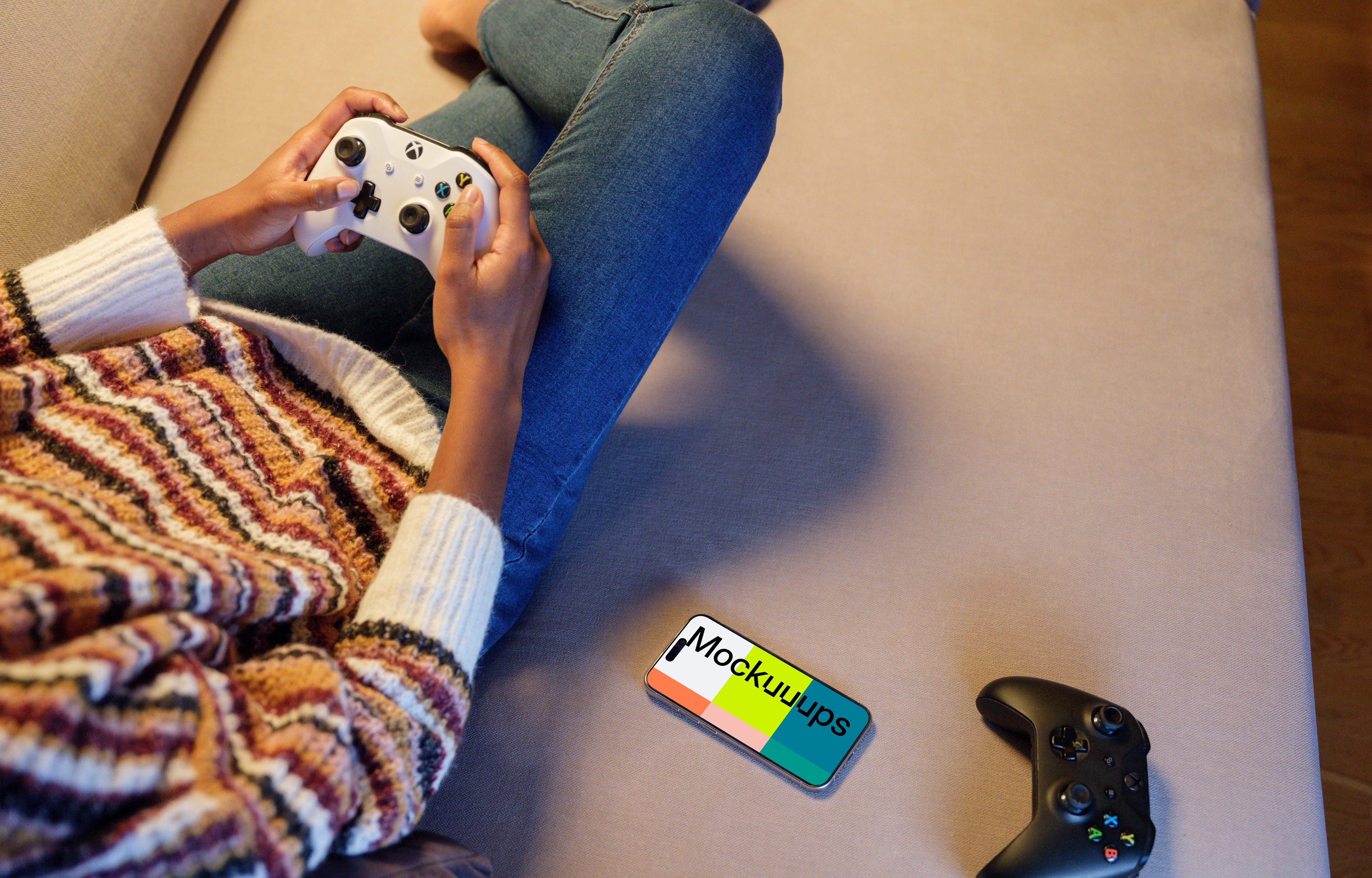 iPhone 15 Pro mockup beside gaming controls