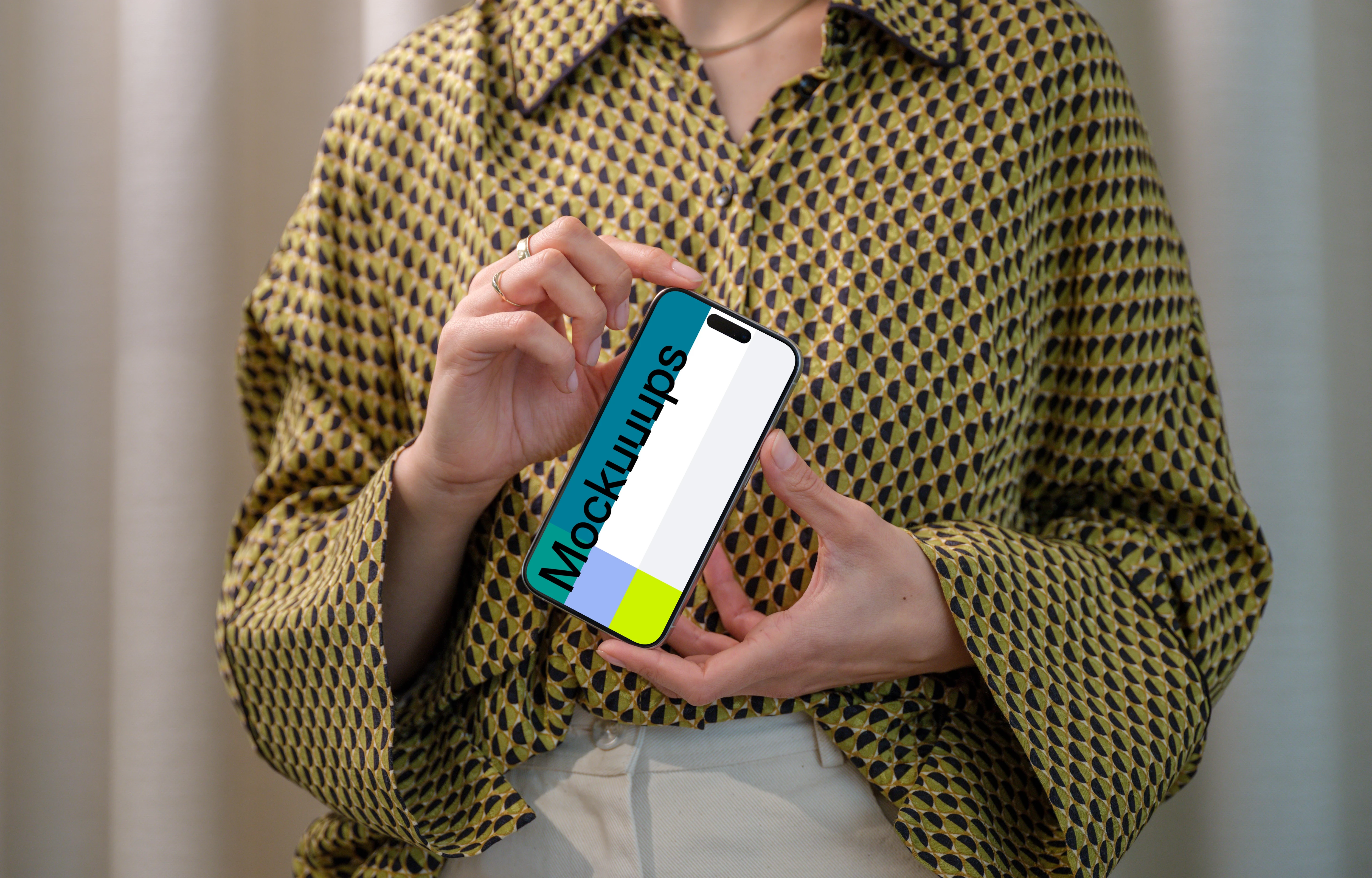 iPhone 15 Pro mockup in a woman's hand with stylish background