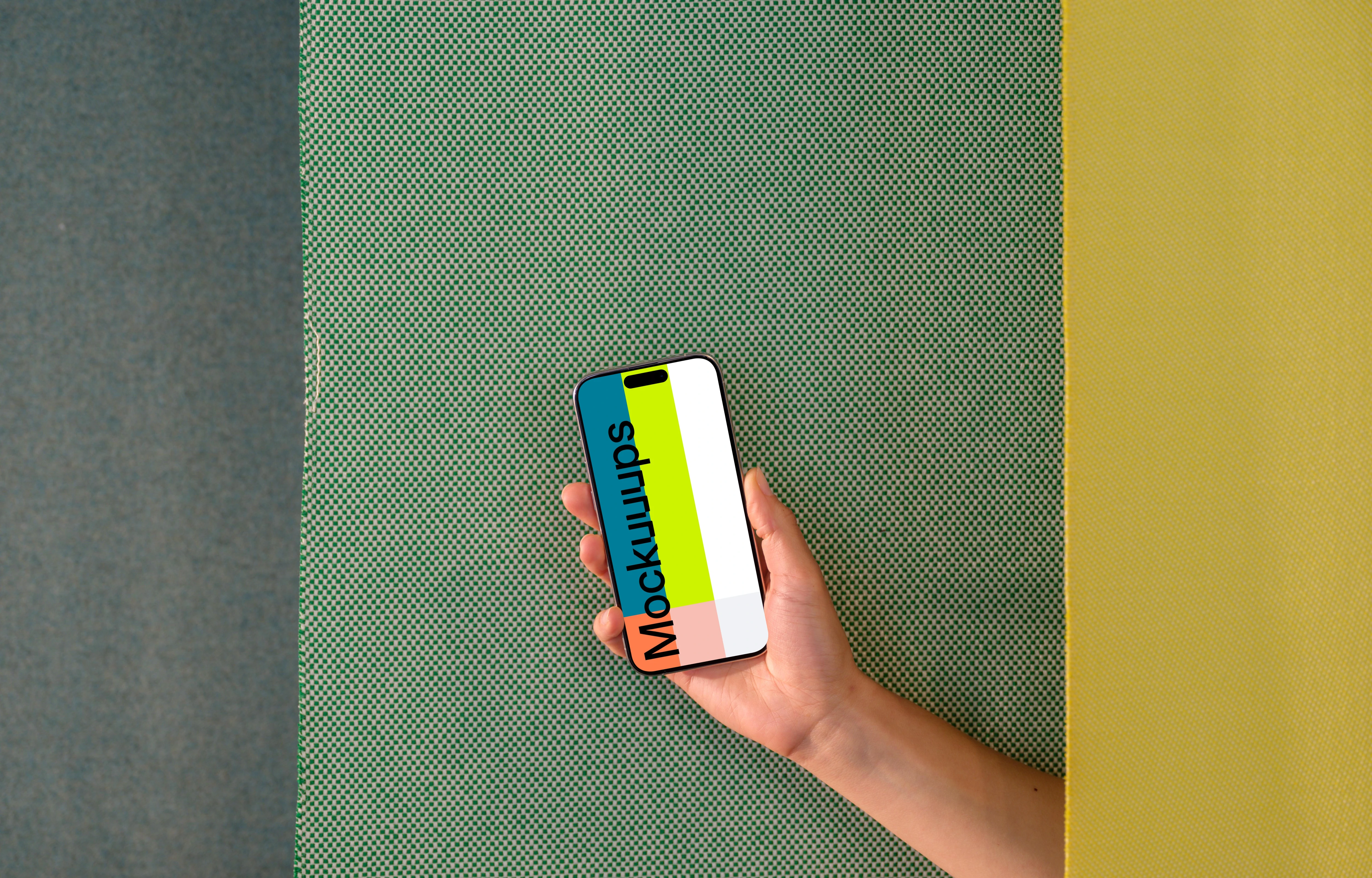 iPhone 15 Pro mockup in hand against dual-tone background