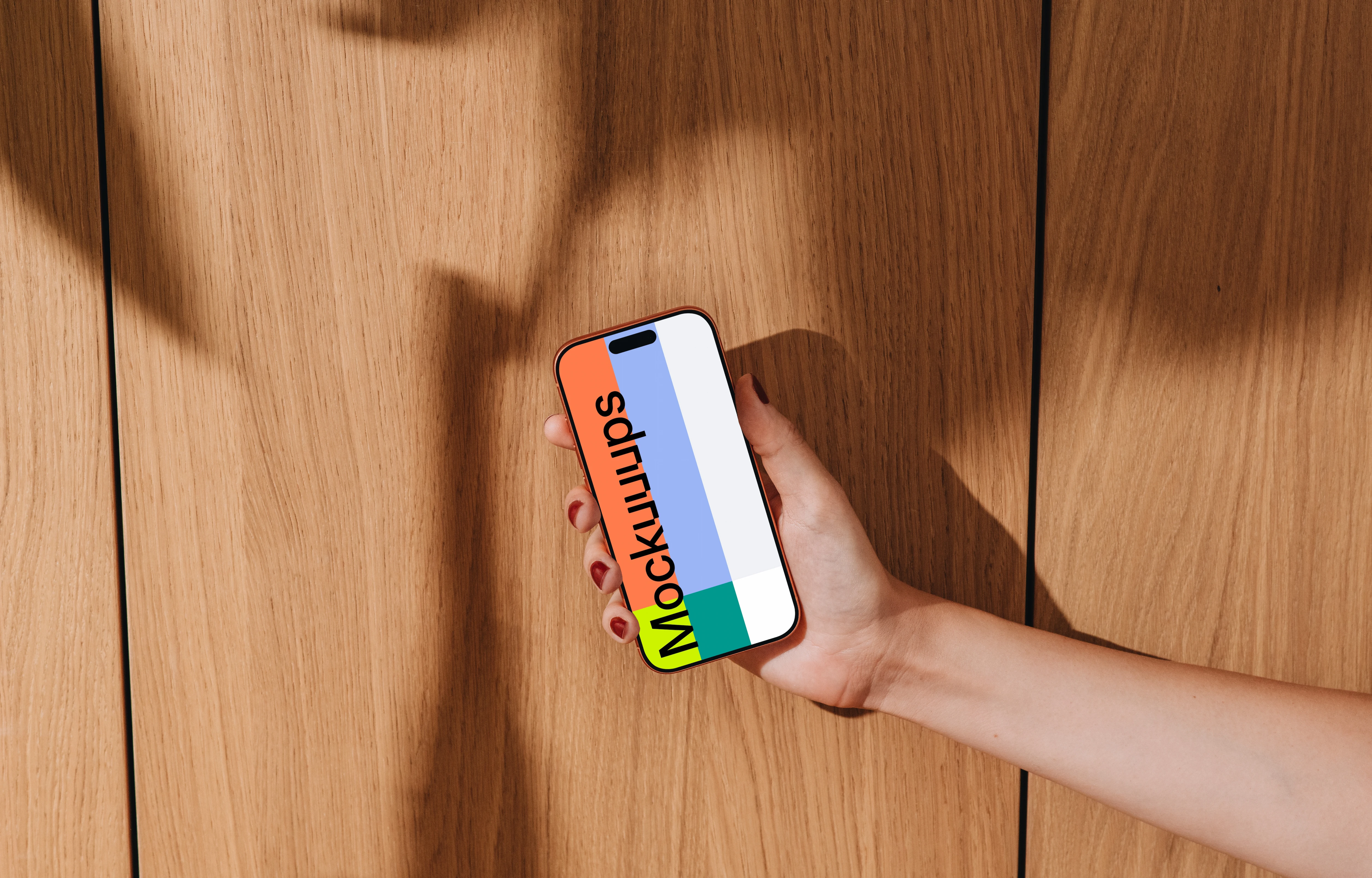 iPhone 17 Pro mockup held against a wooden background