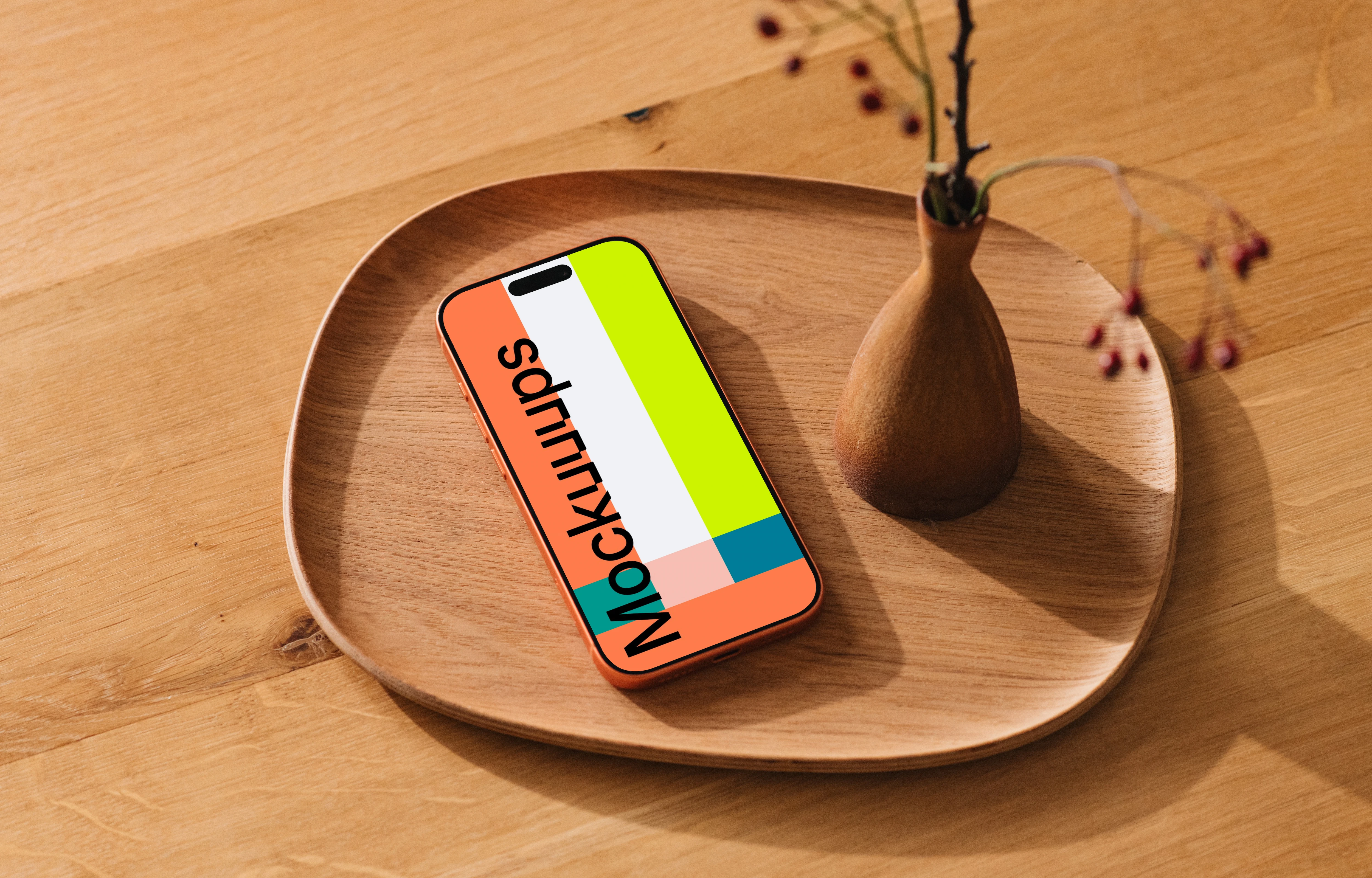 iPhone 17 Pro mockup on a wooden dish with vase