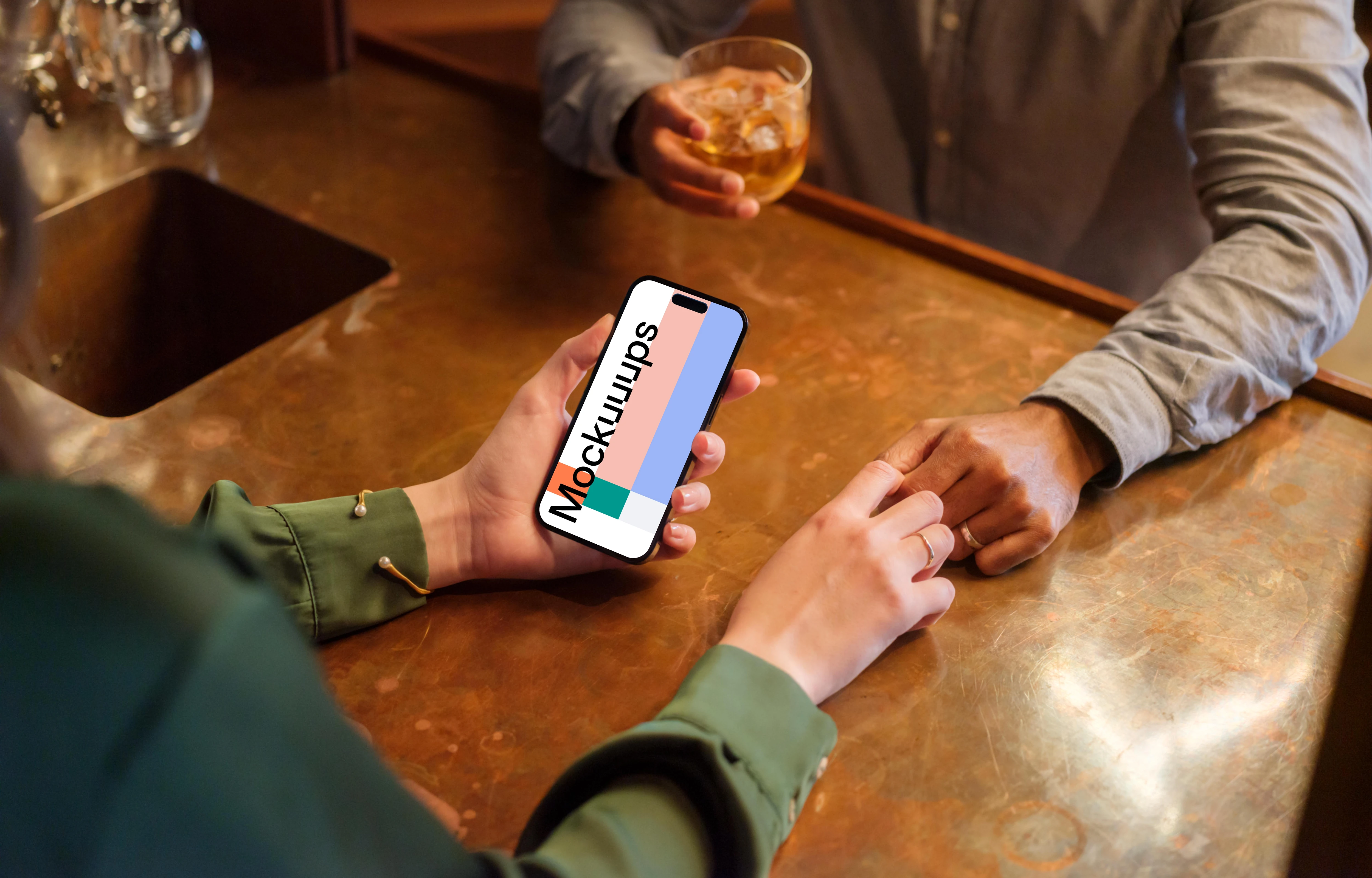 iPhone mockup held by woman in the lounge setting