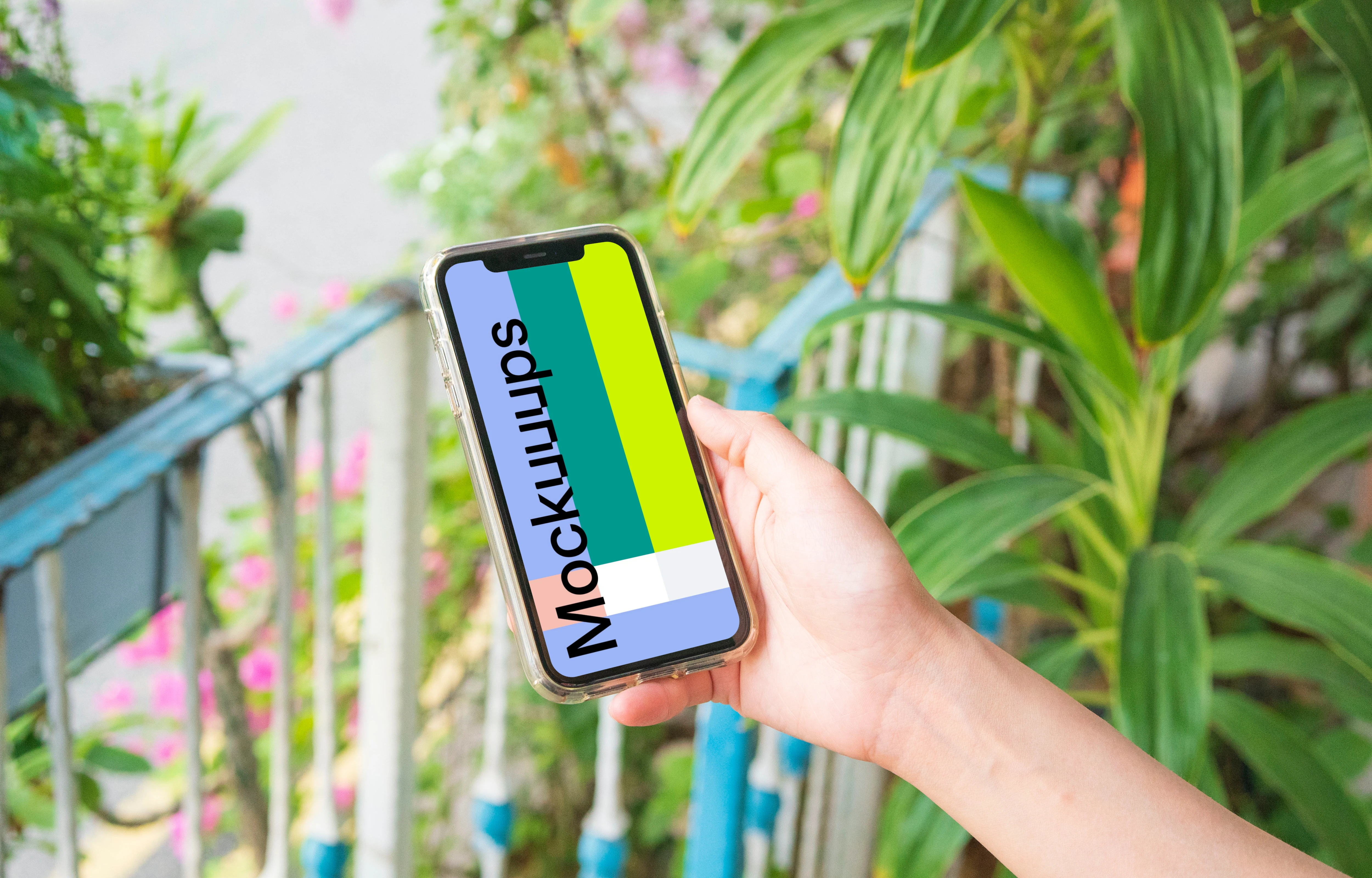 iPhone mockup held on a mockup