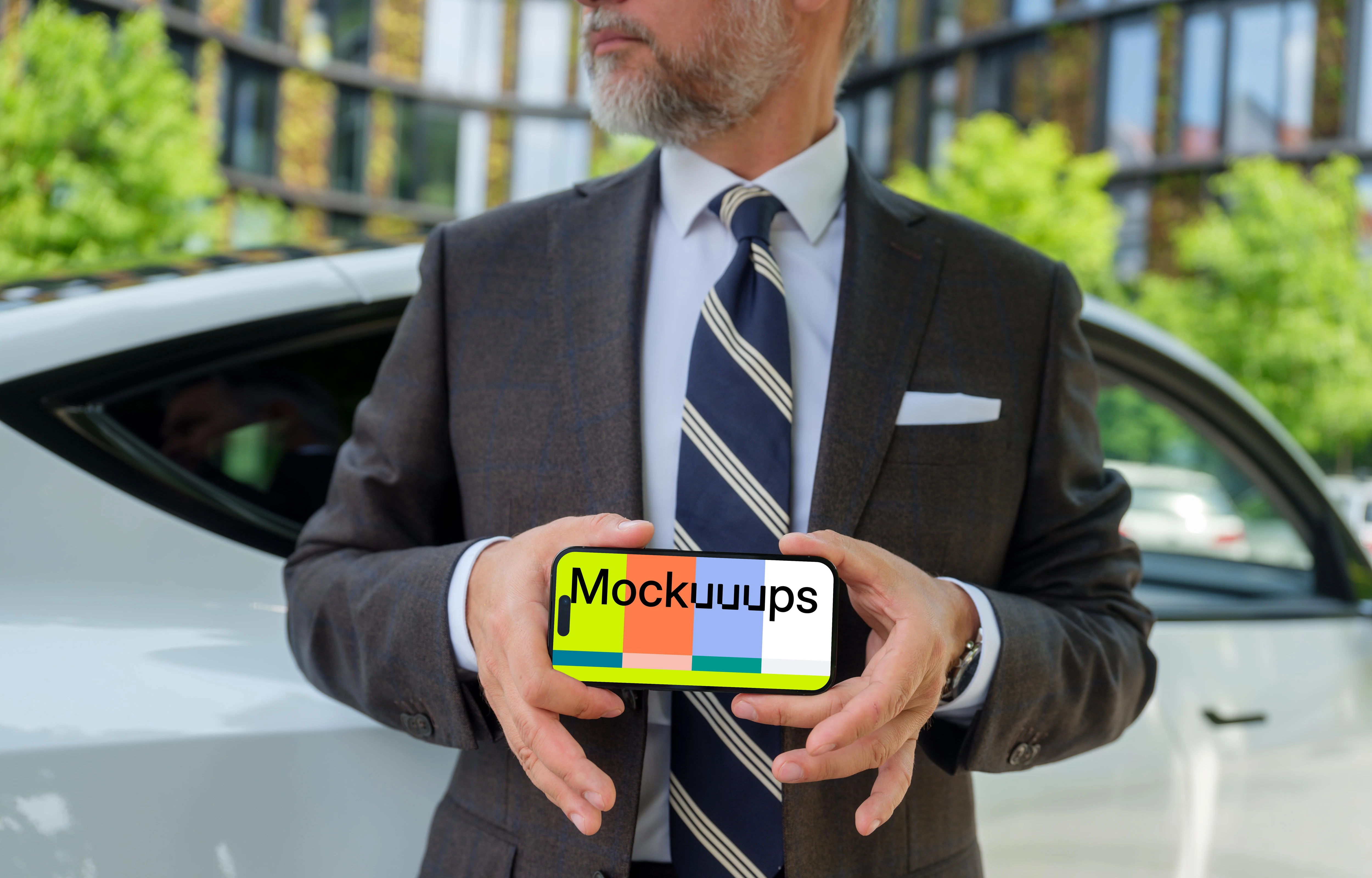 iPhone mockup in businessman’s hands