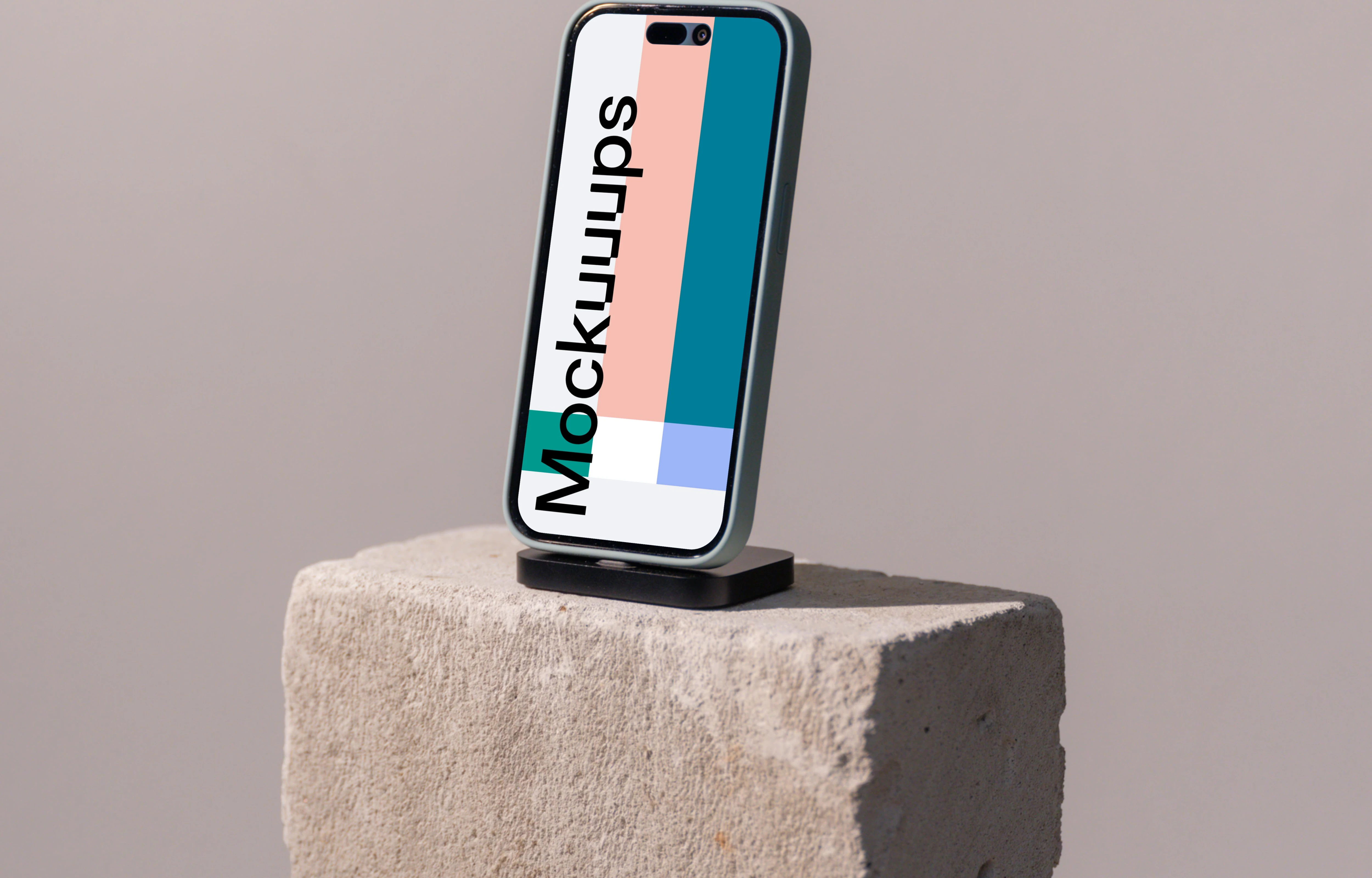 iPhone mockup on a concrete brick
