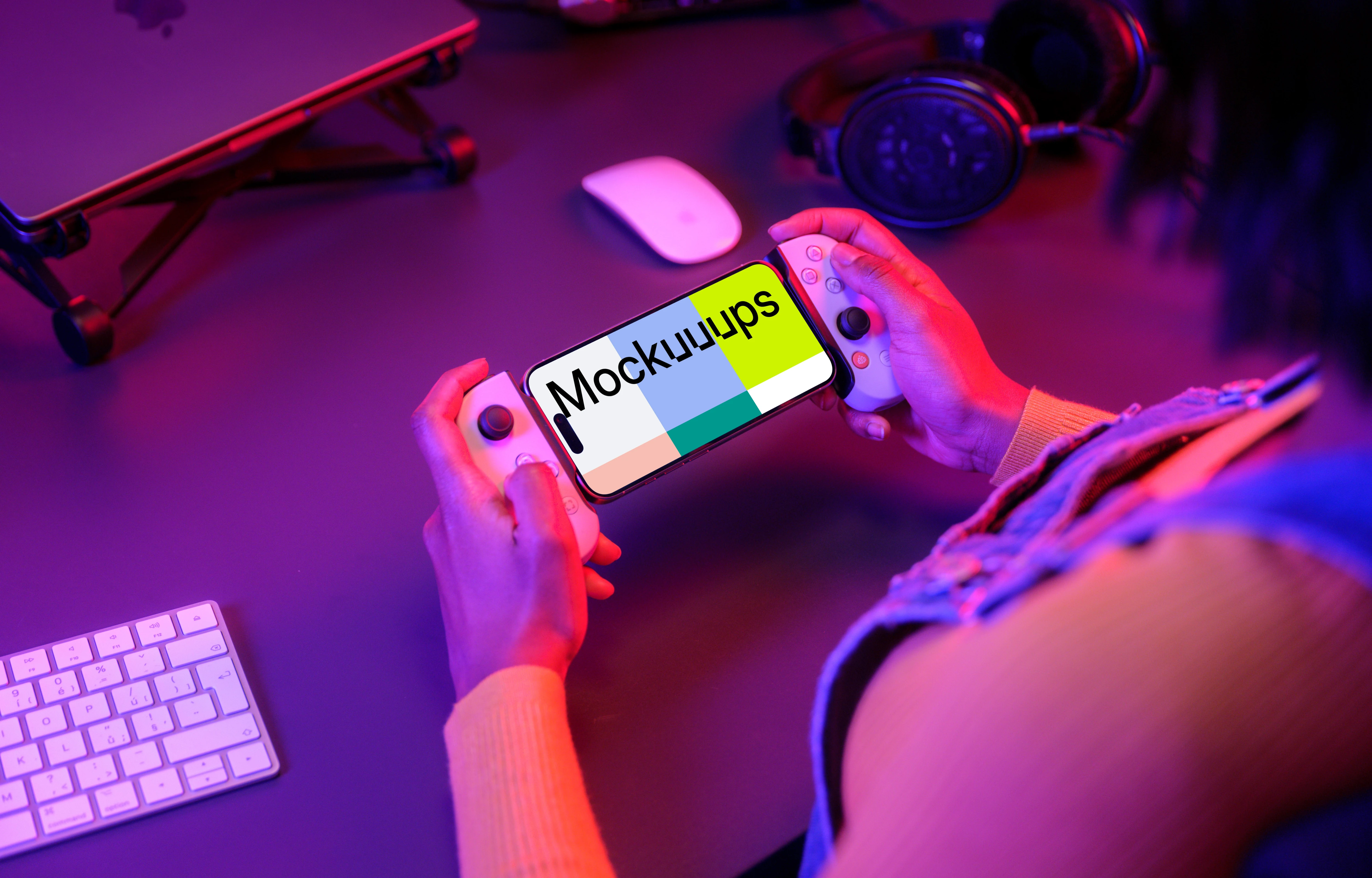 iPhone 15 Pro mockup in a gamer's hand with neon lighting