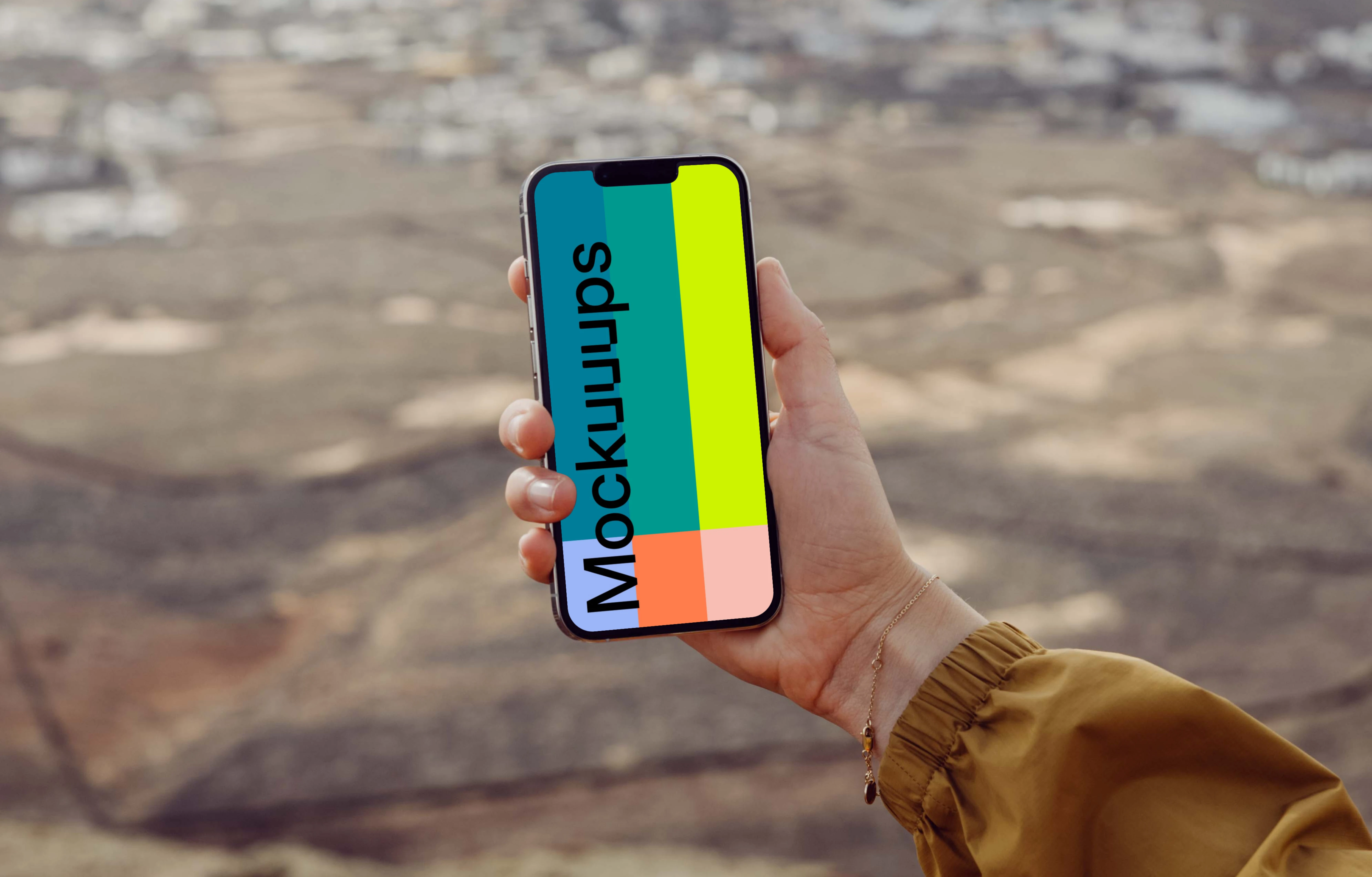  iPhone 13 Pro mockup held by a user from a high location.