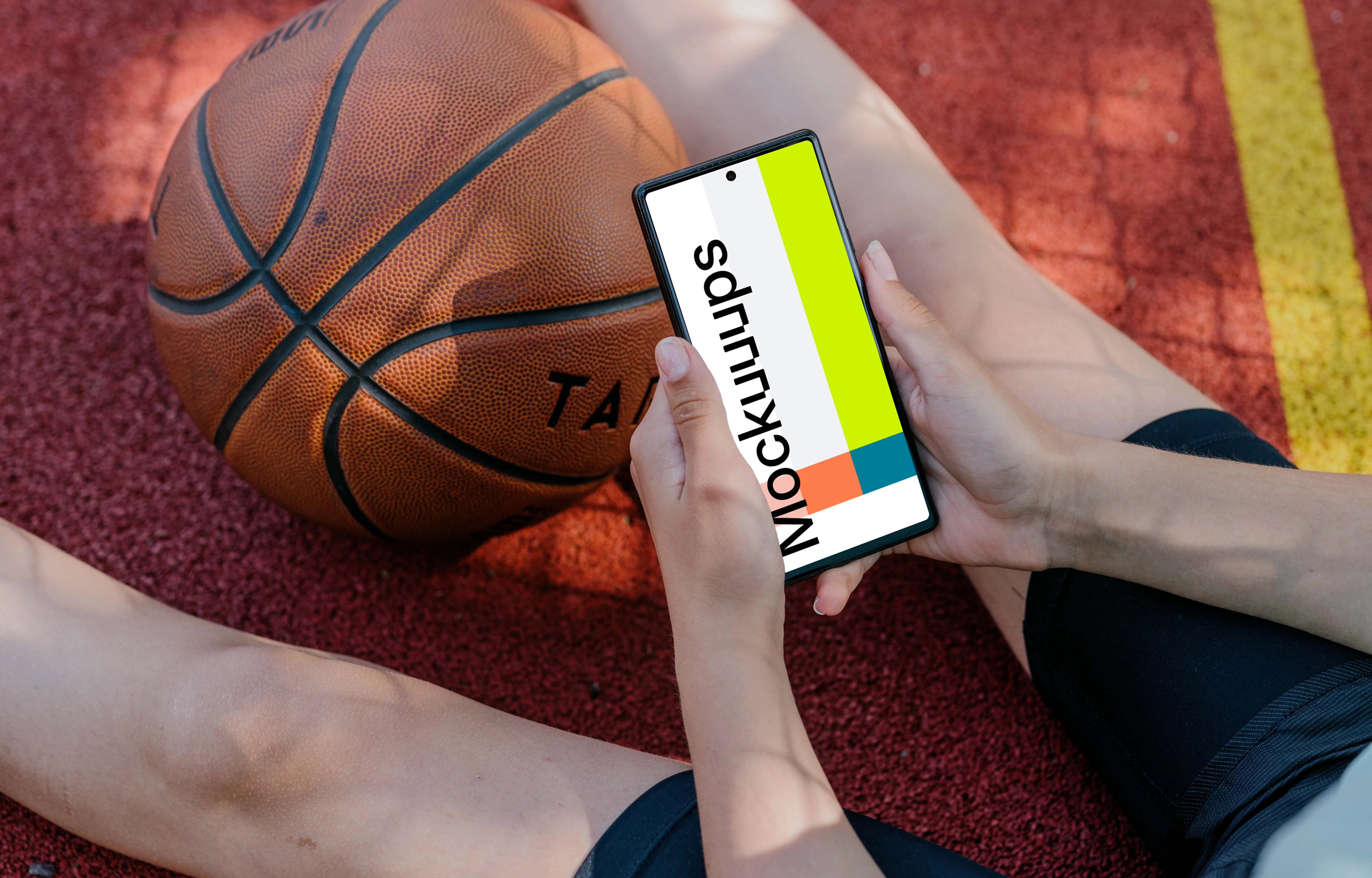 Basketball player checking on a Google Pixel mockup