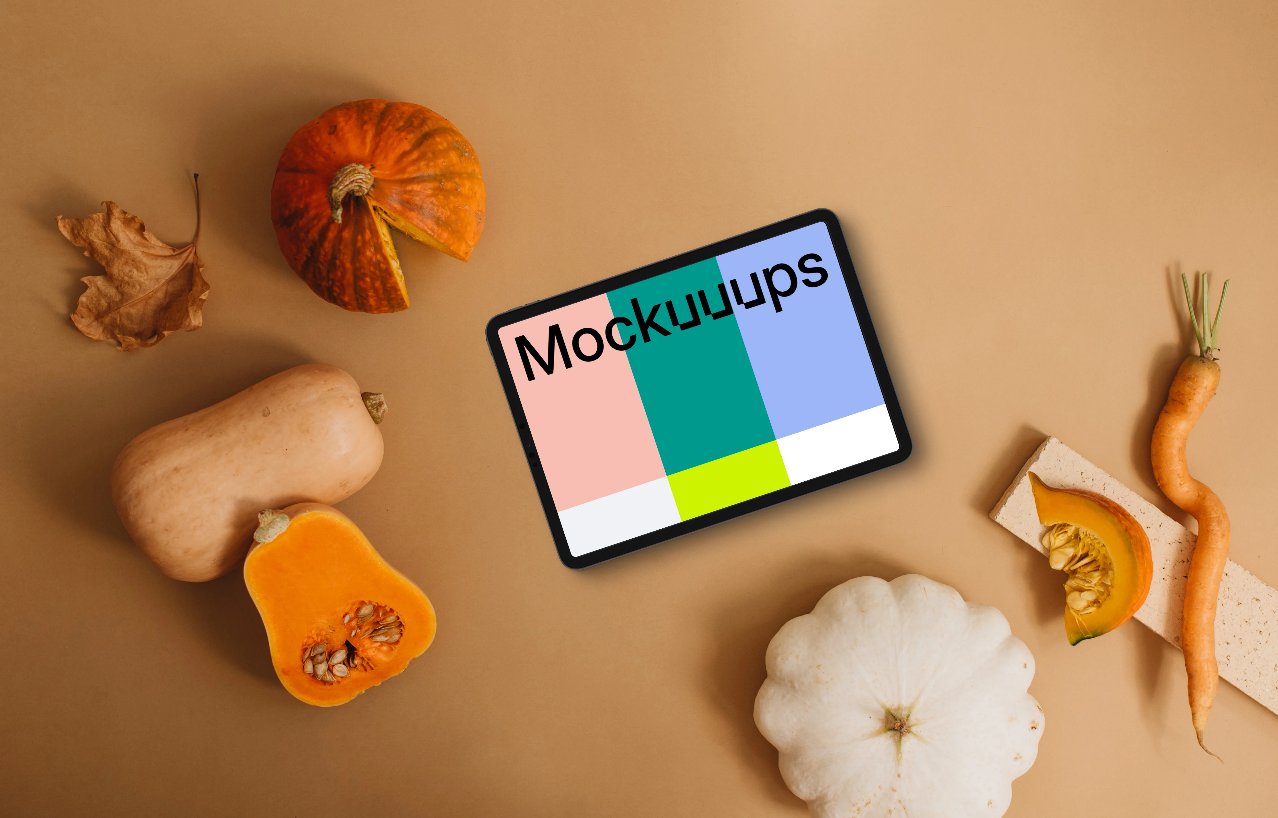 Landscape tablet mockup next to the pumpkin