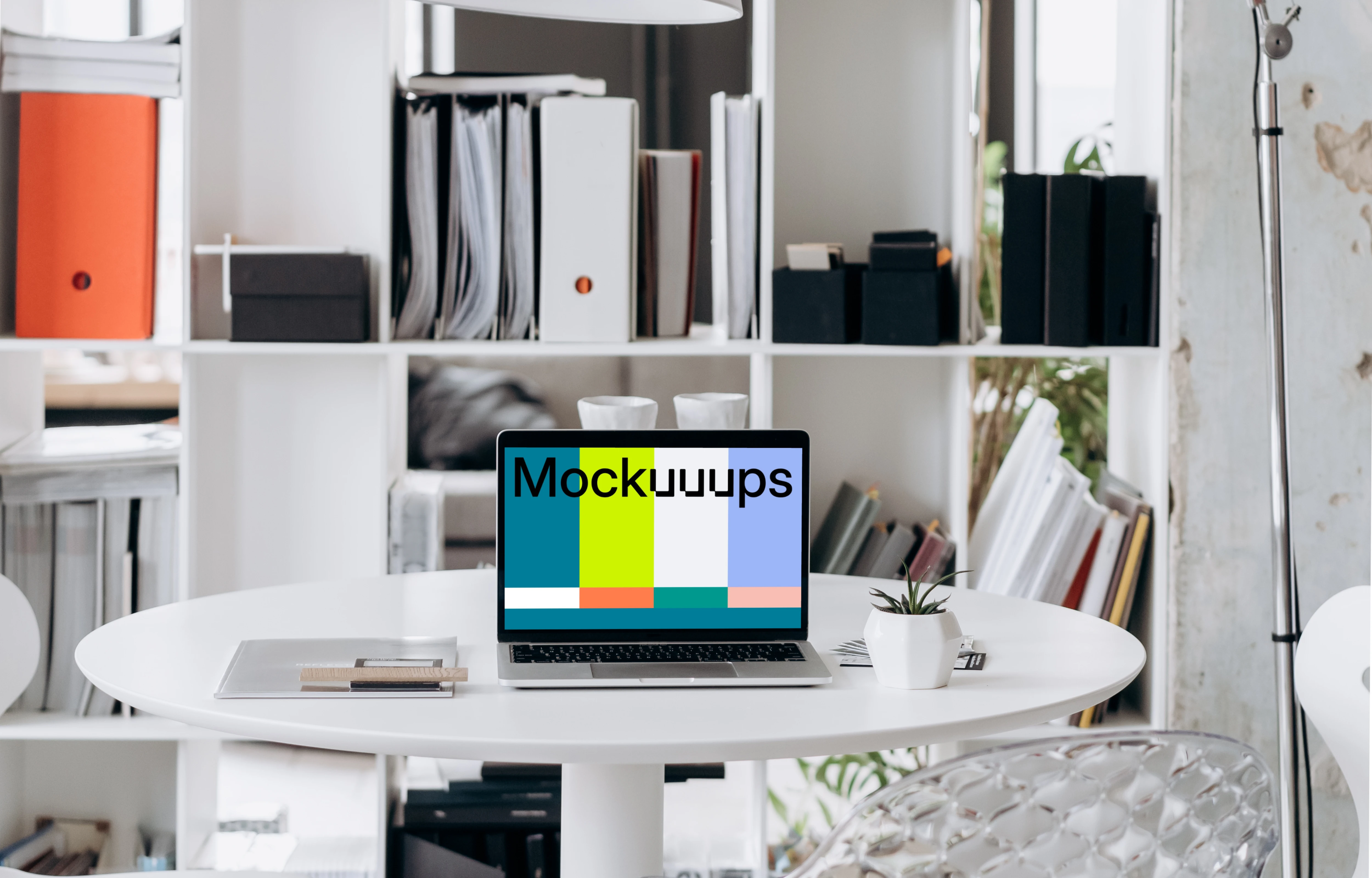 Laptop mockup in an office setting with overhead lamp