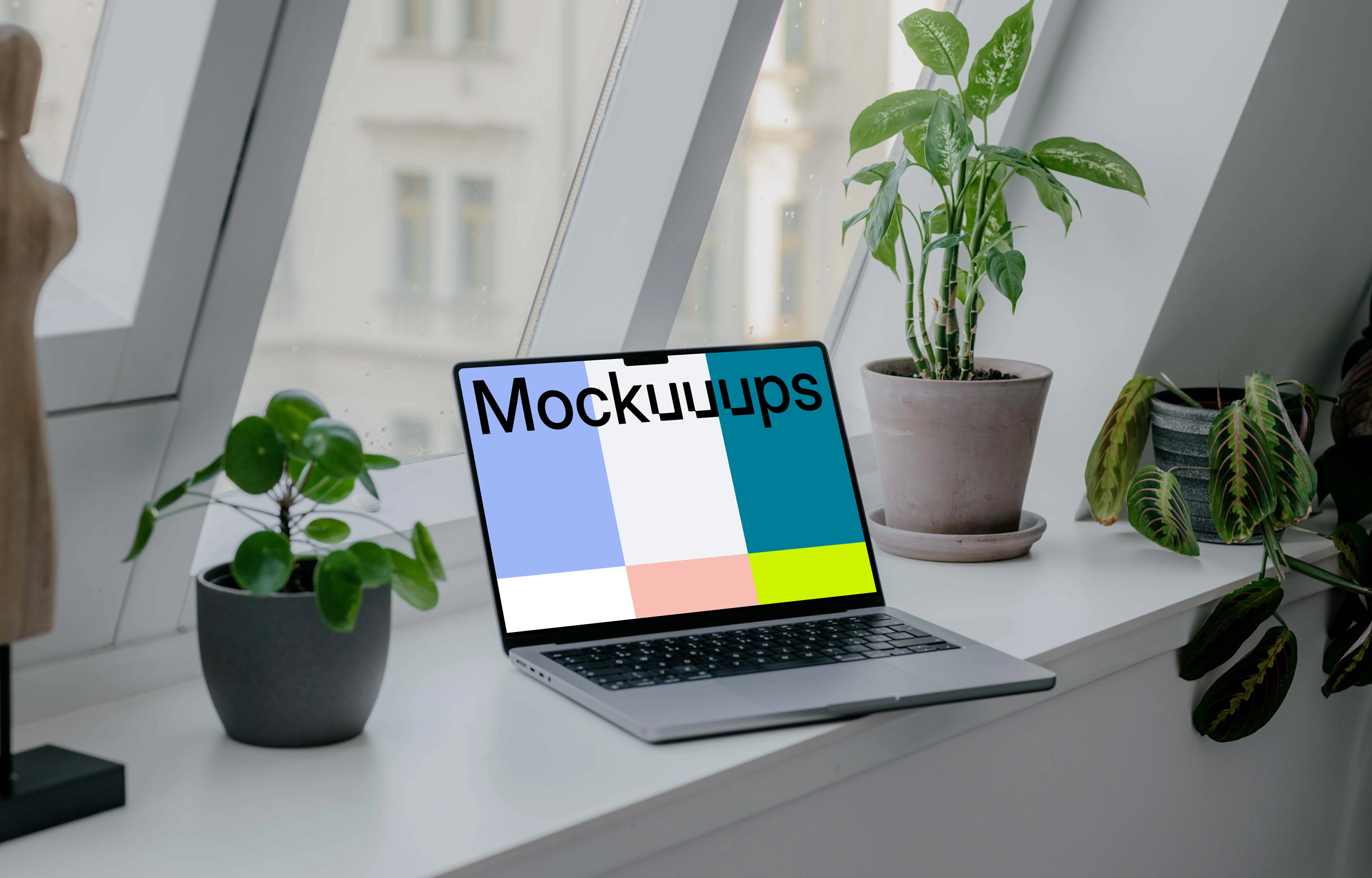 Laptop mockup next to the window