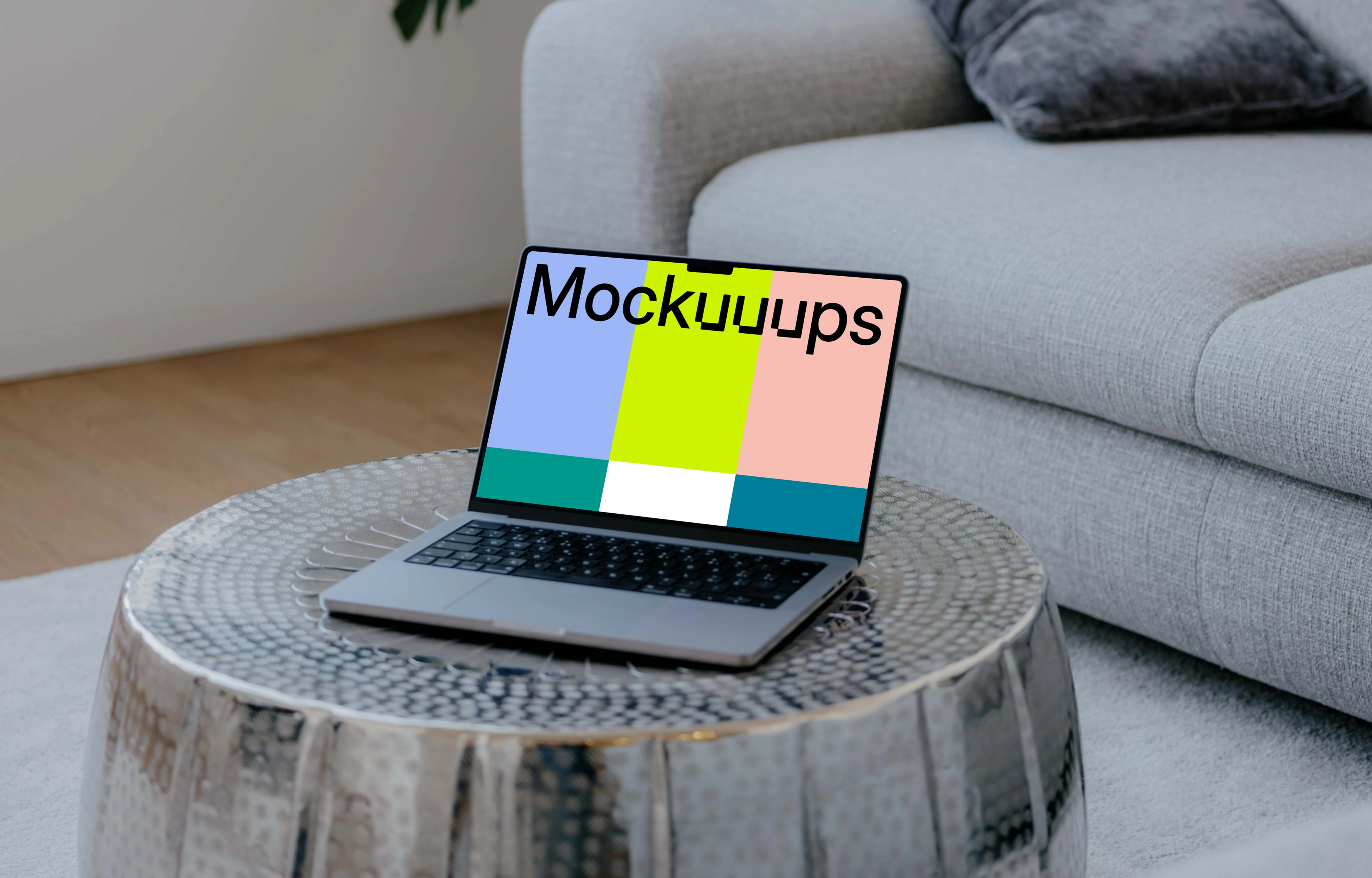 Laptop mockup on the silver table