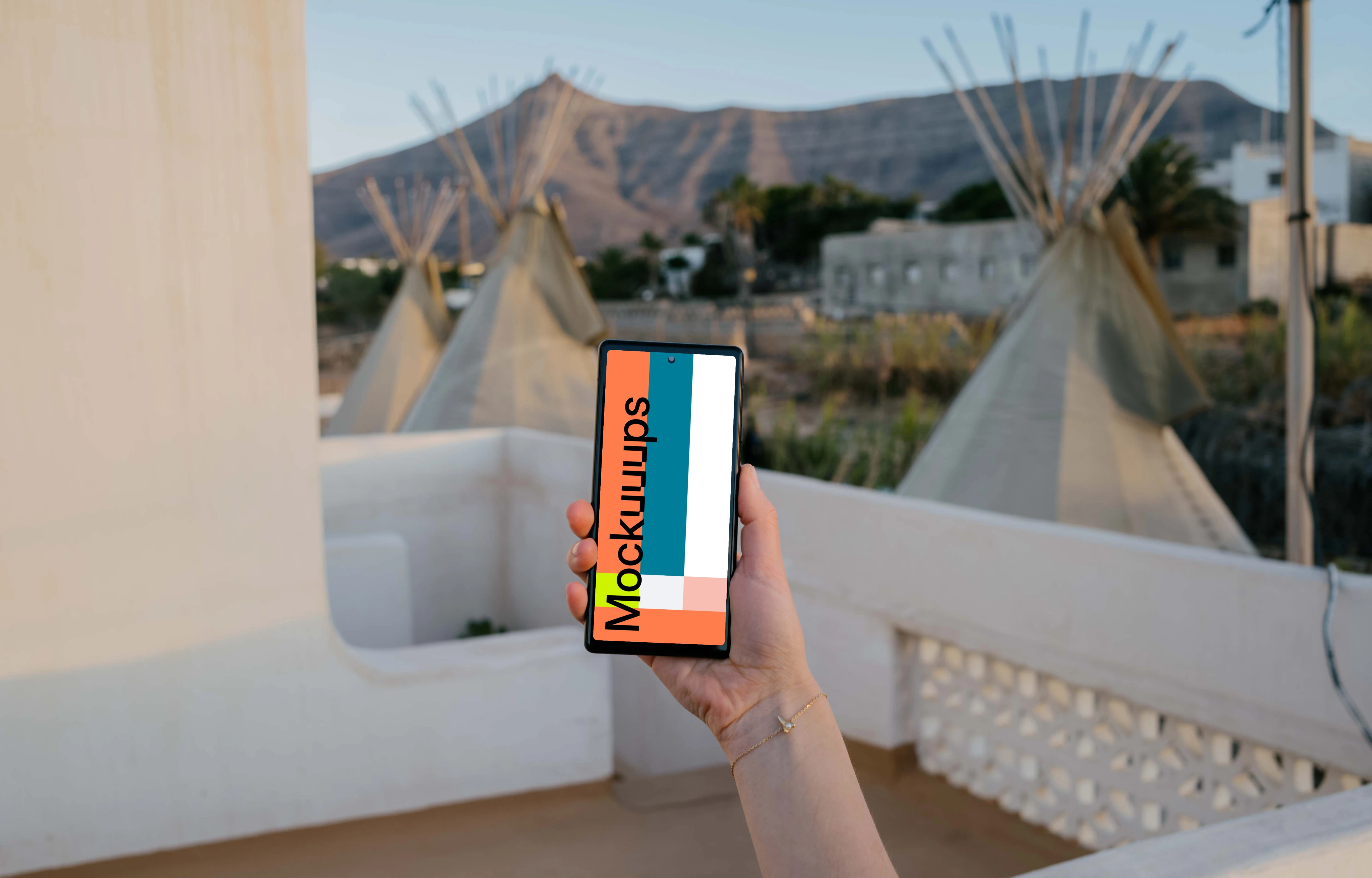 Pixel 6 mockup held in on a balcony