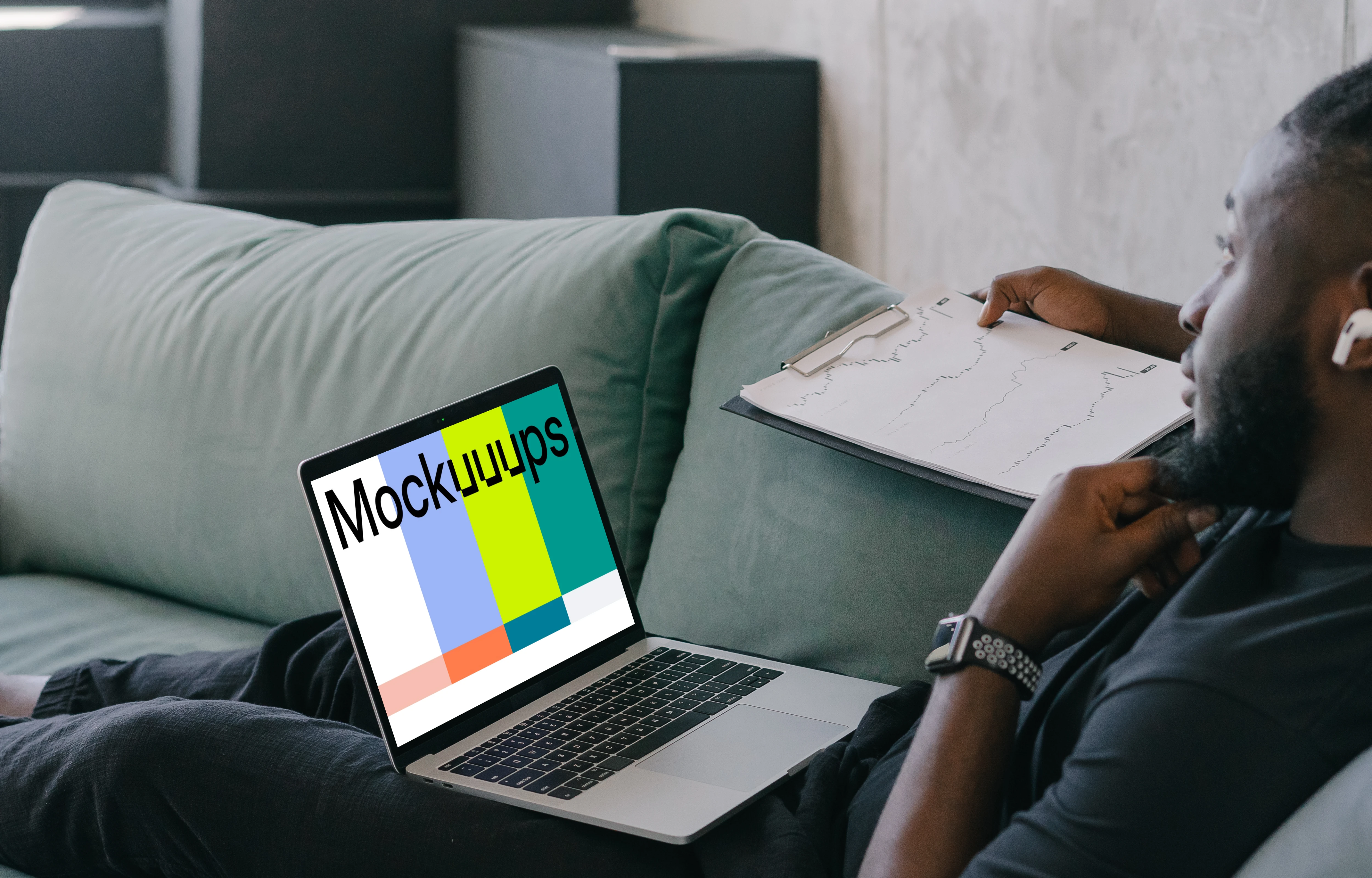 MacBook Air mockup in use by a man wearing Airpods