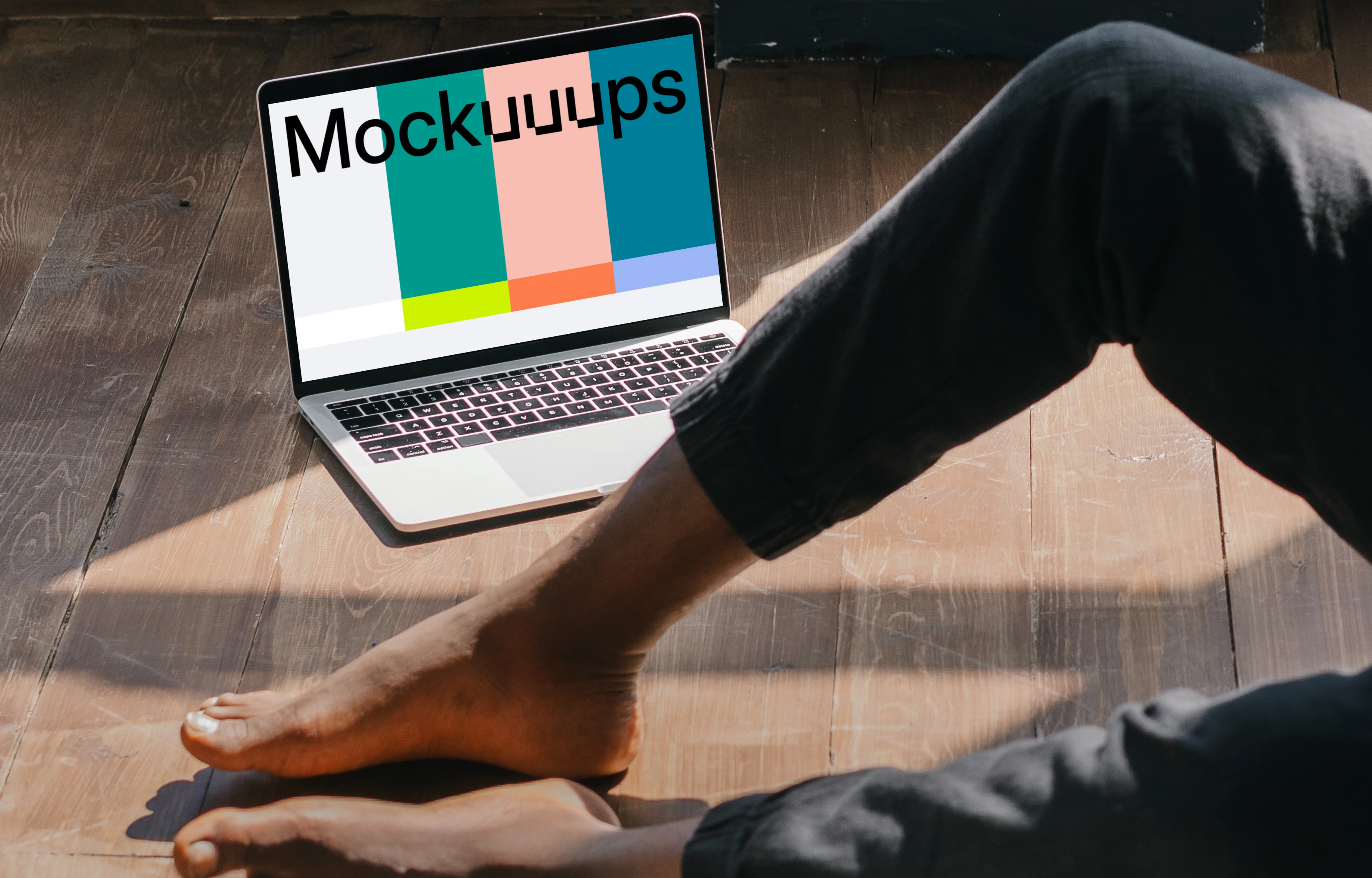 MacBook Air mockup placed on a wooden floor next to a user