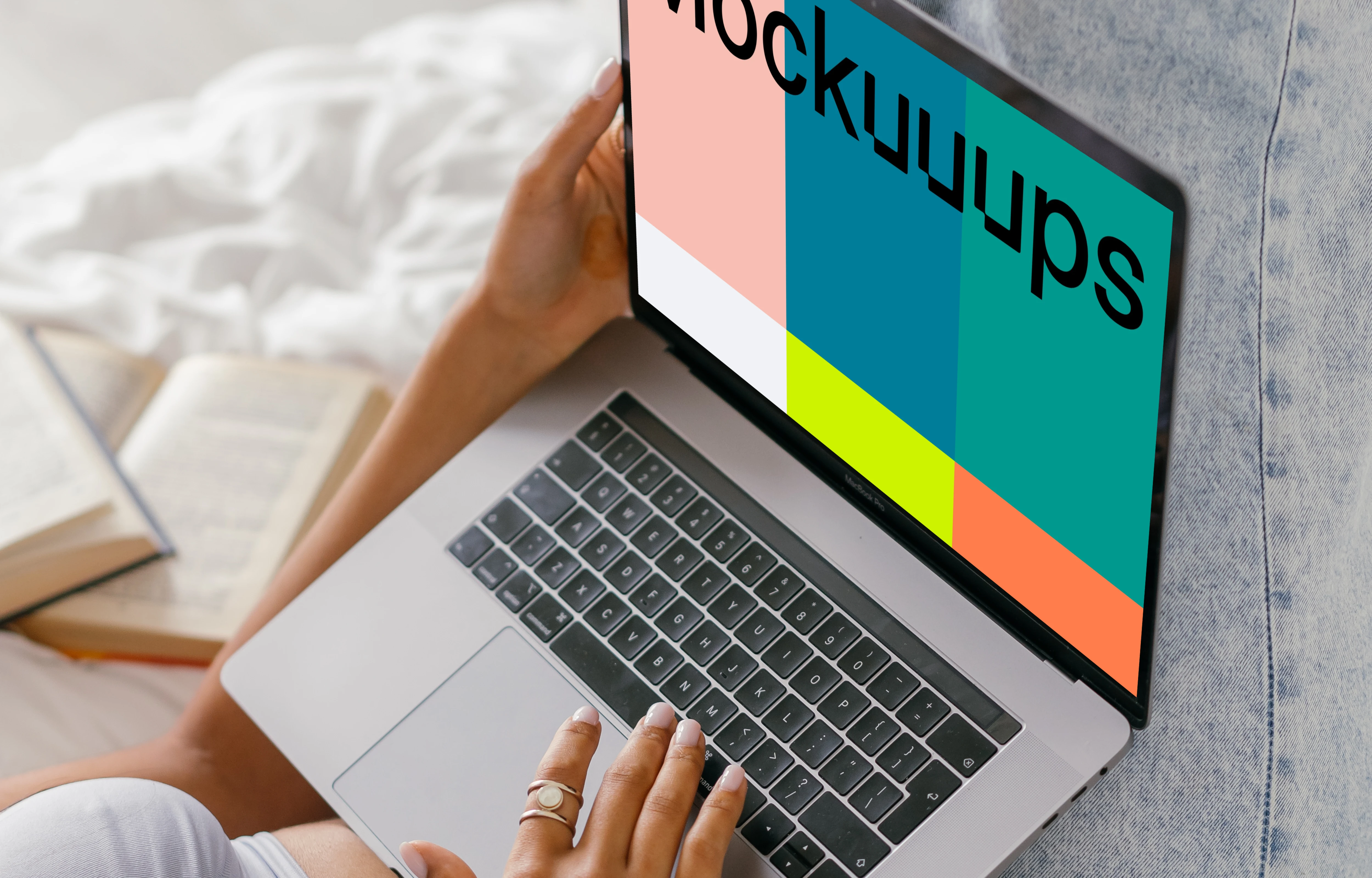 MacBook Air mockup used in bed by a lady