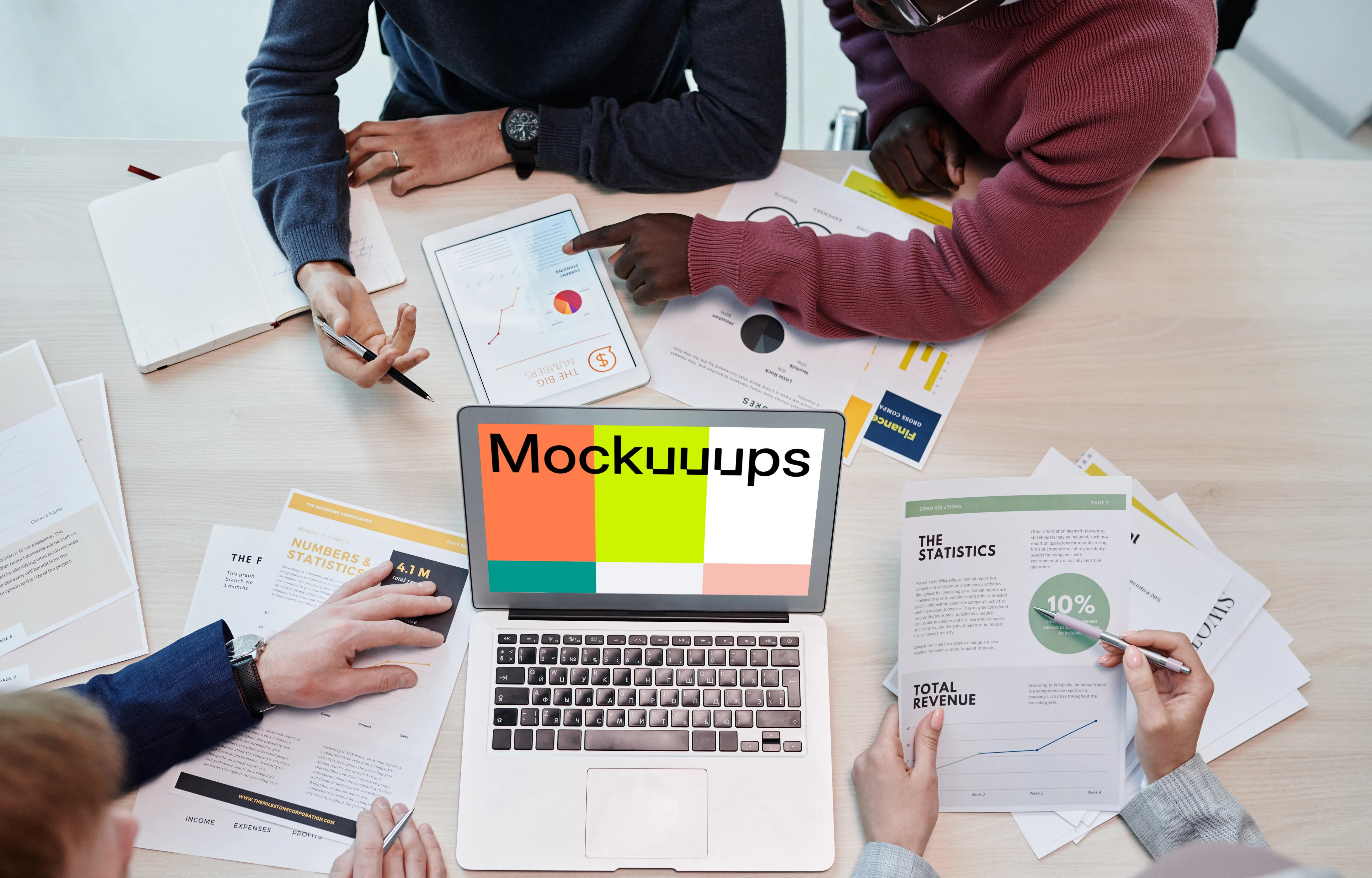 MacBook Air mokcup beside business documents