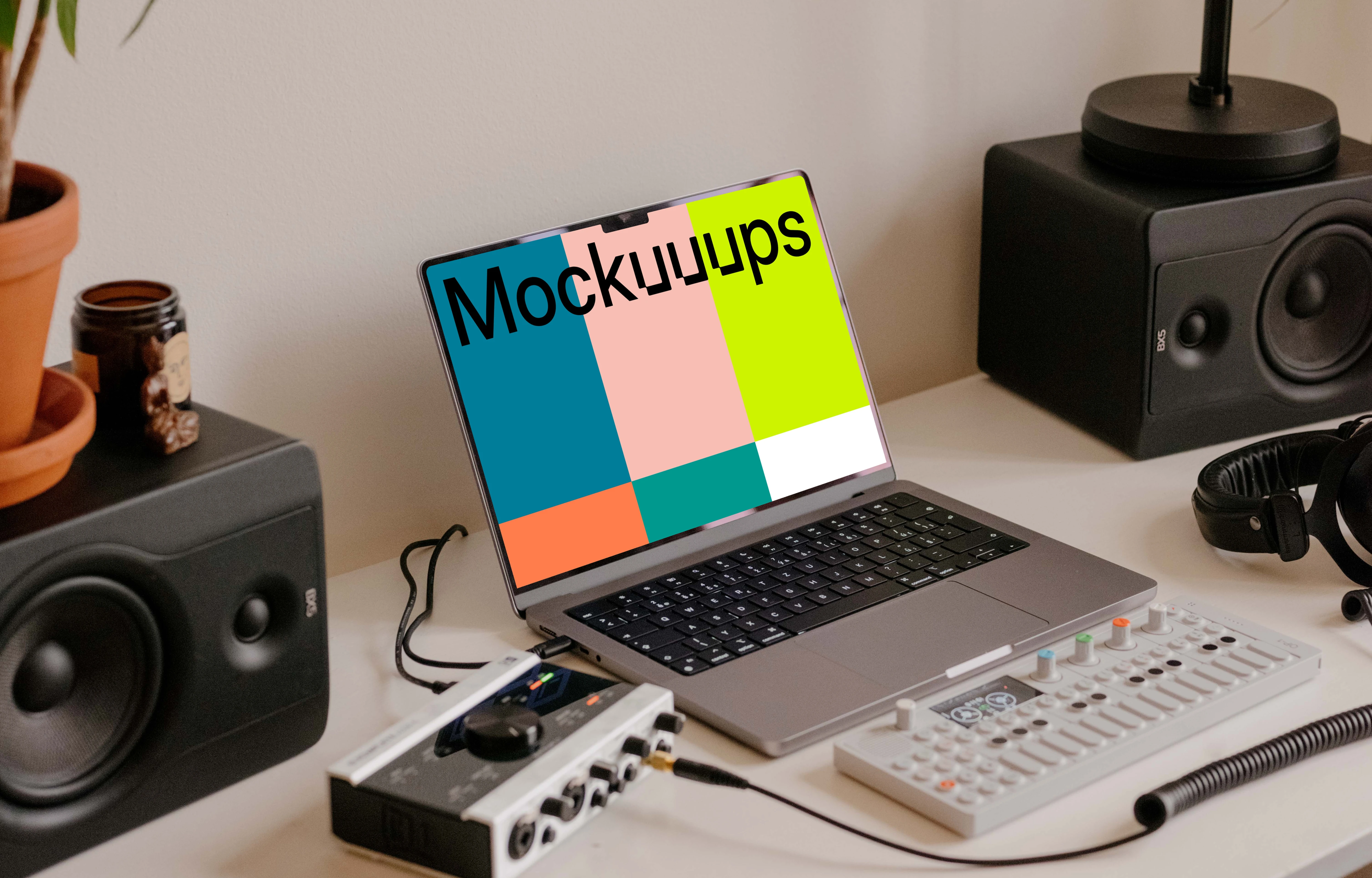 MacBook Pro mockup in the small podcast studio