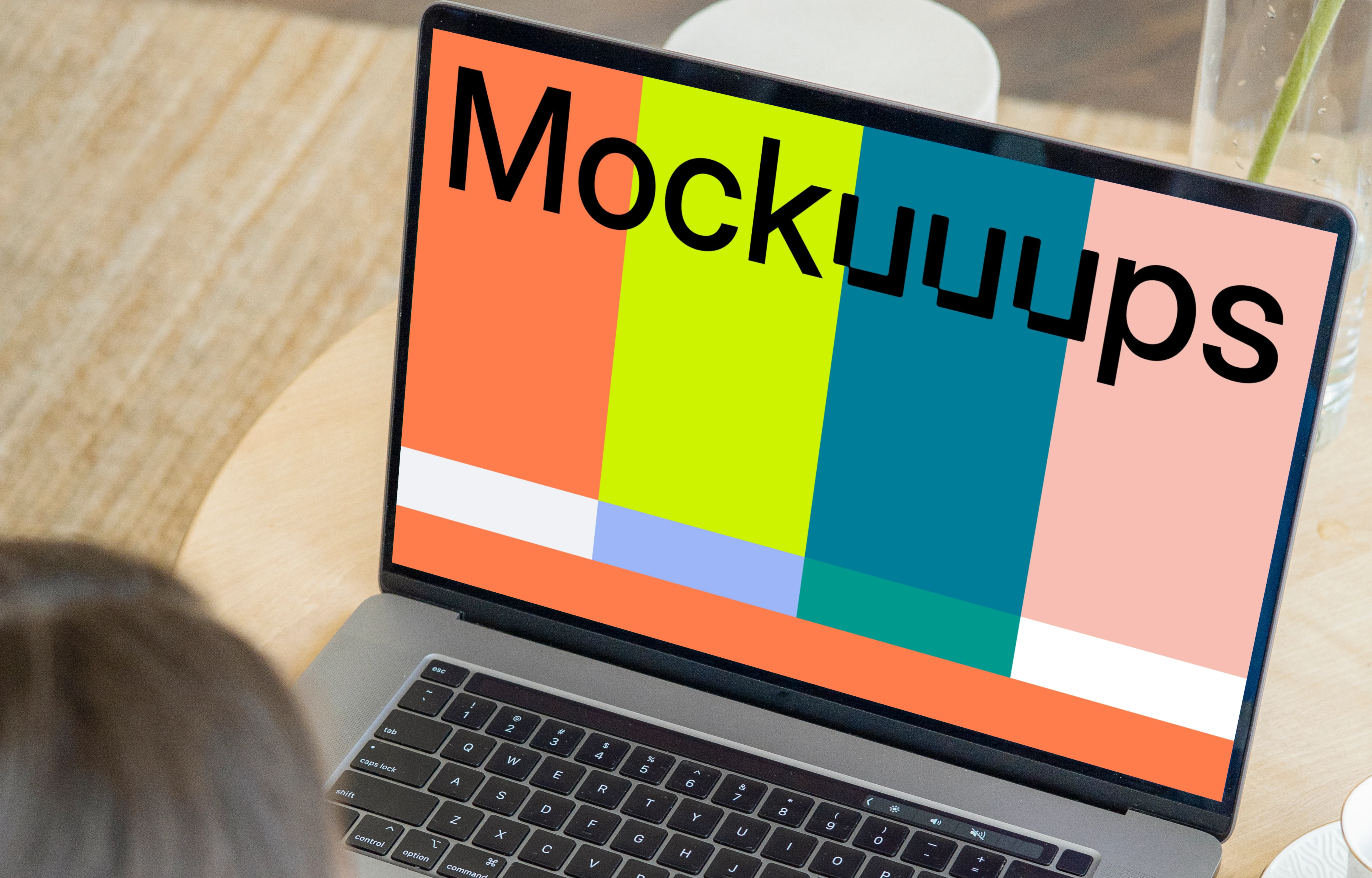 MacBook Pro mockup on a round wooden table