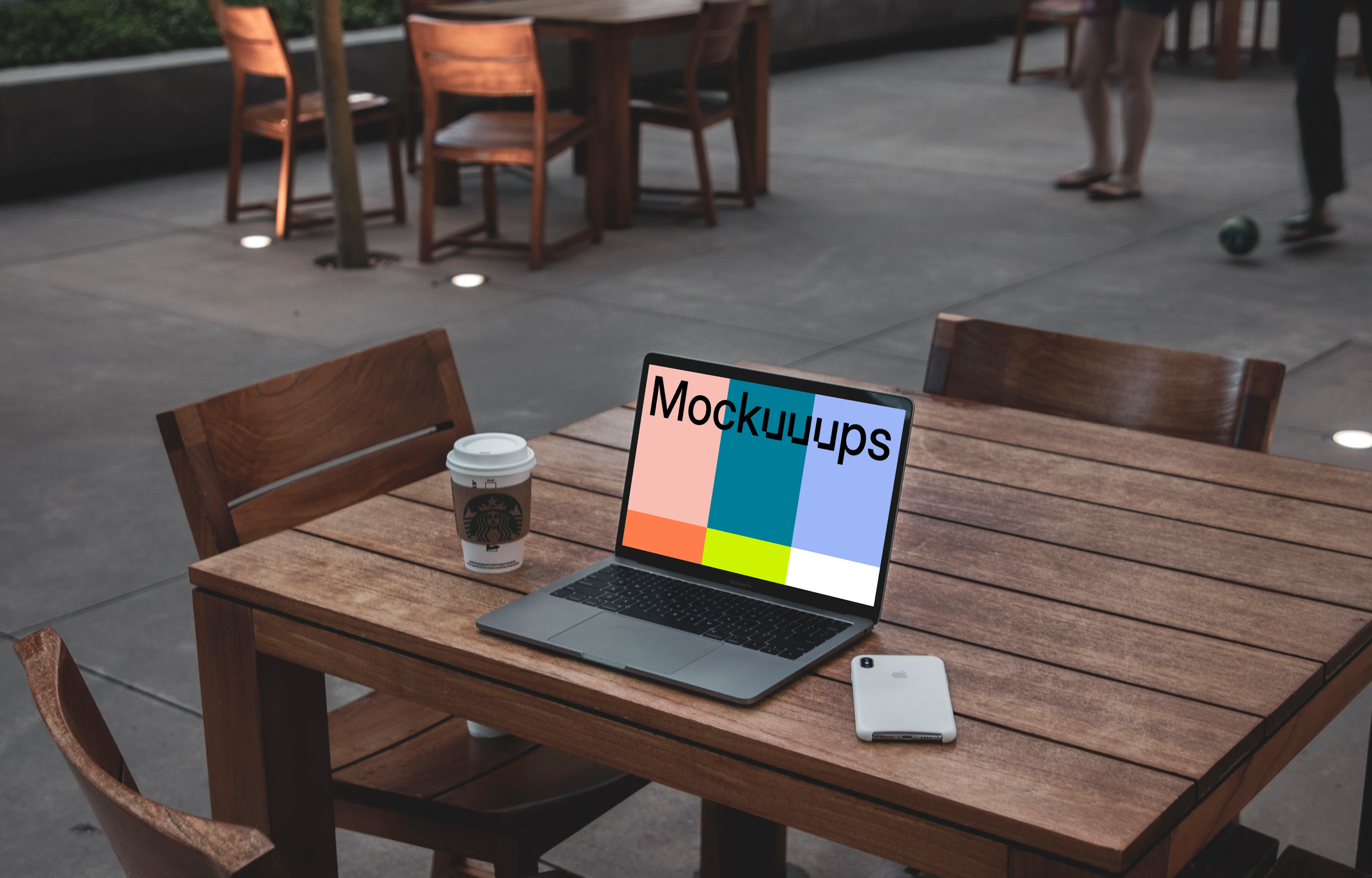 MacBook Pro mockup on wooden desk