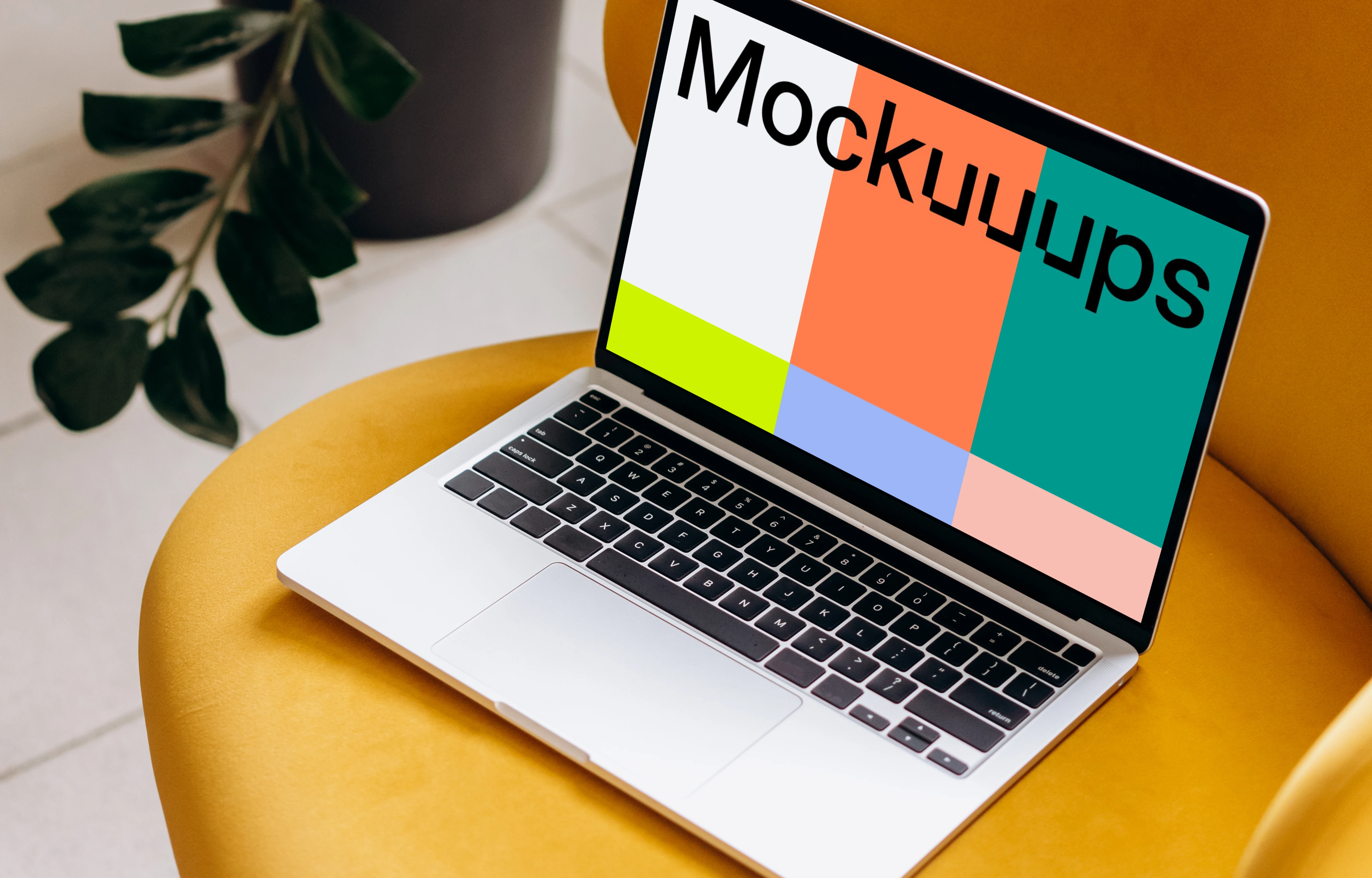 MacBook Pro mockup placed on a yellow chair