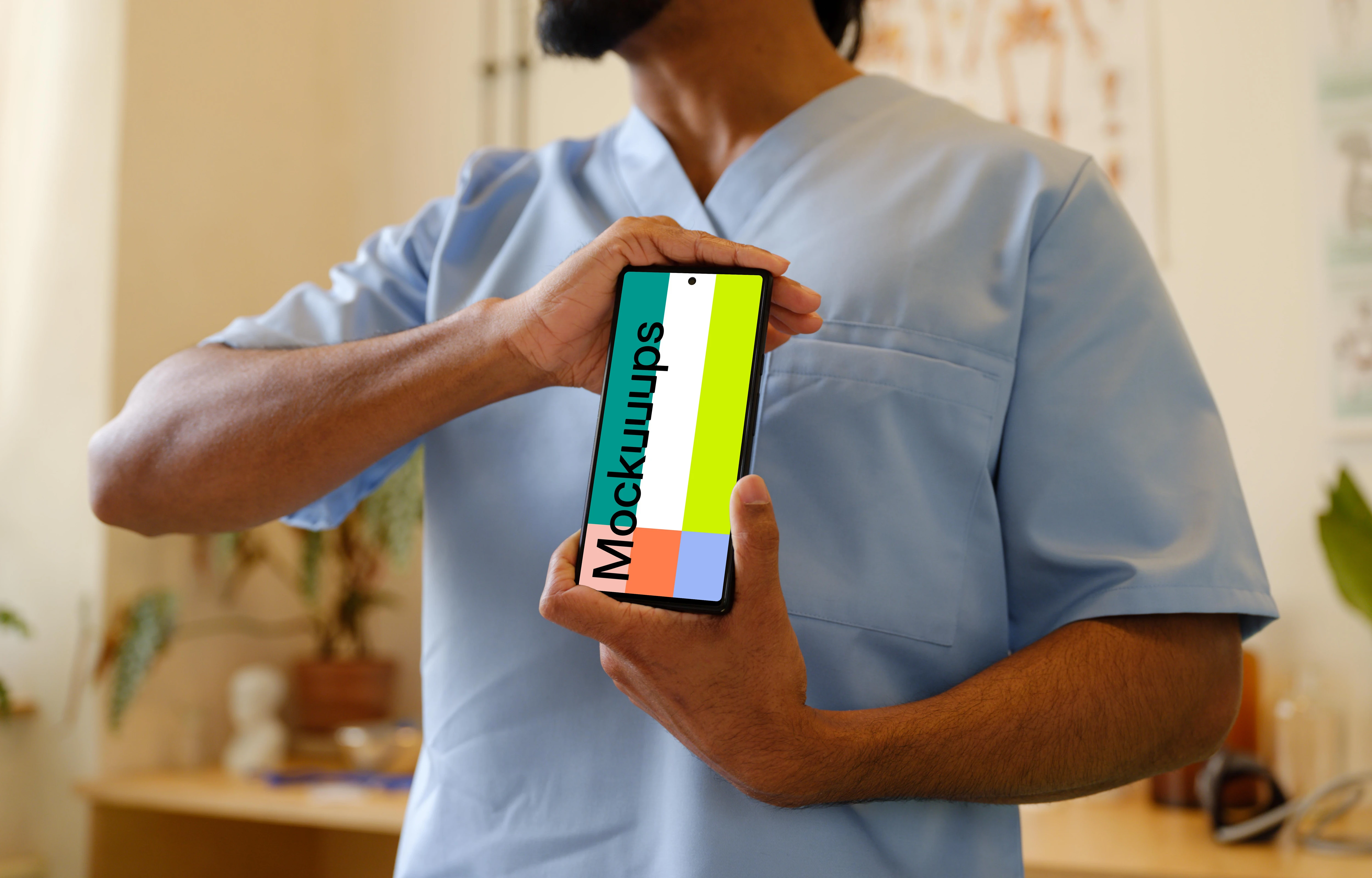 Male doctor holding a Google Pixel mockup