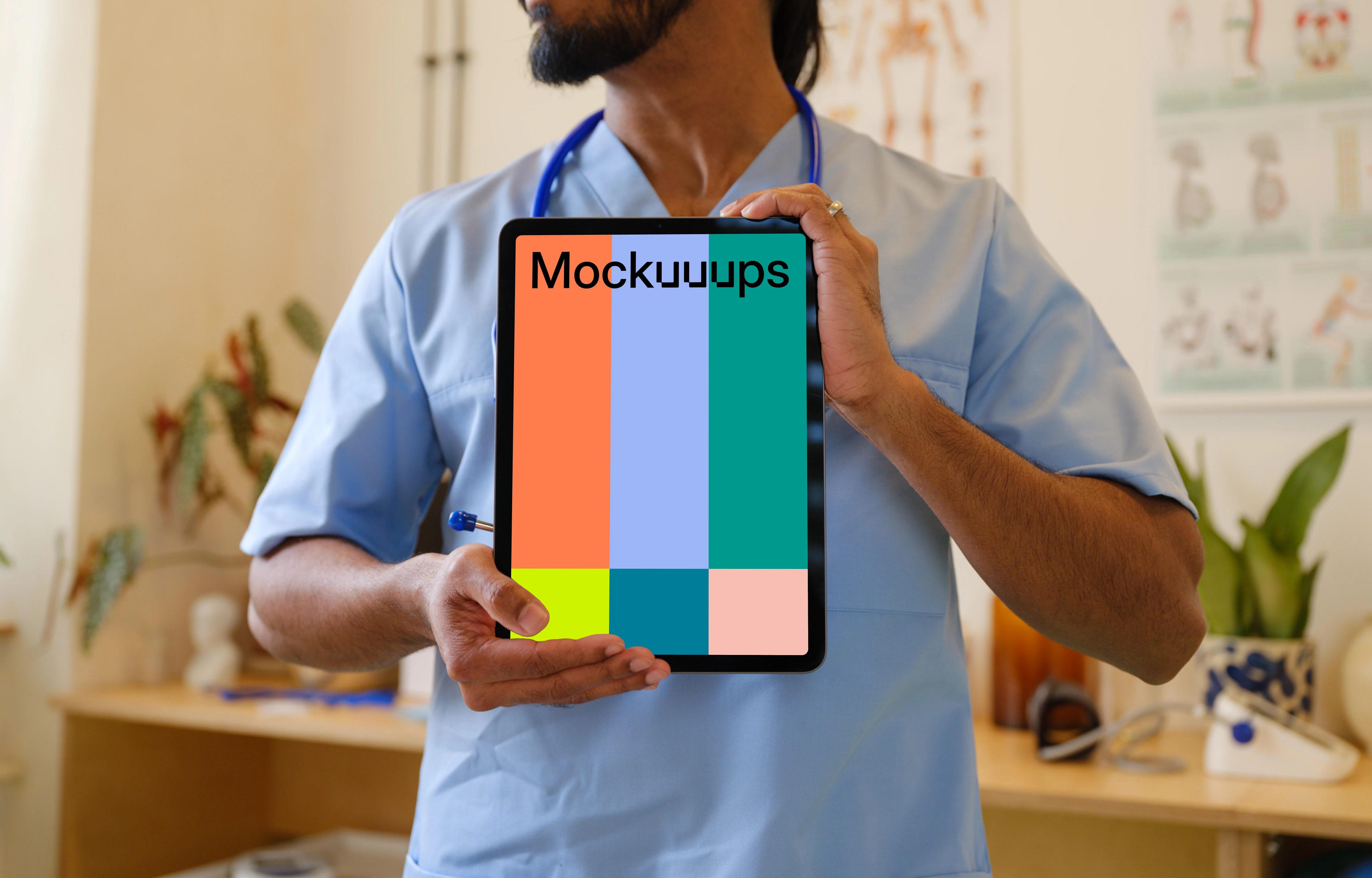 Male doctor holding an iPad mockup