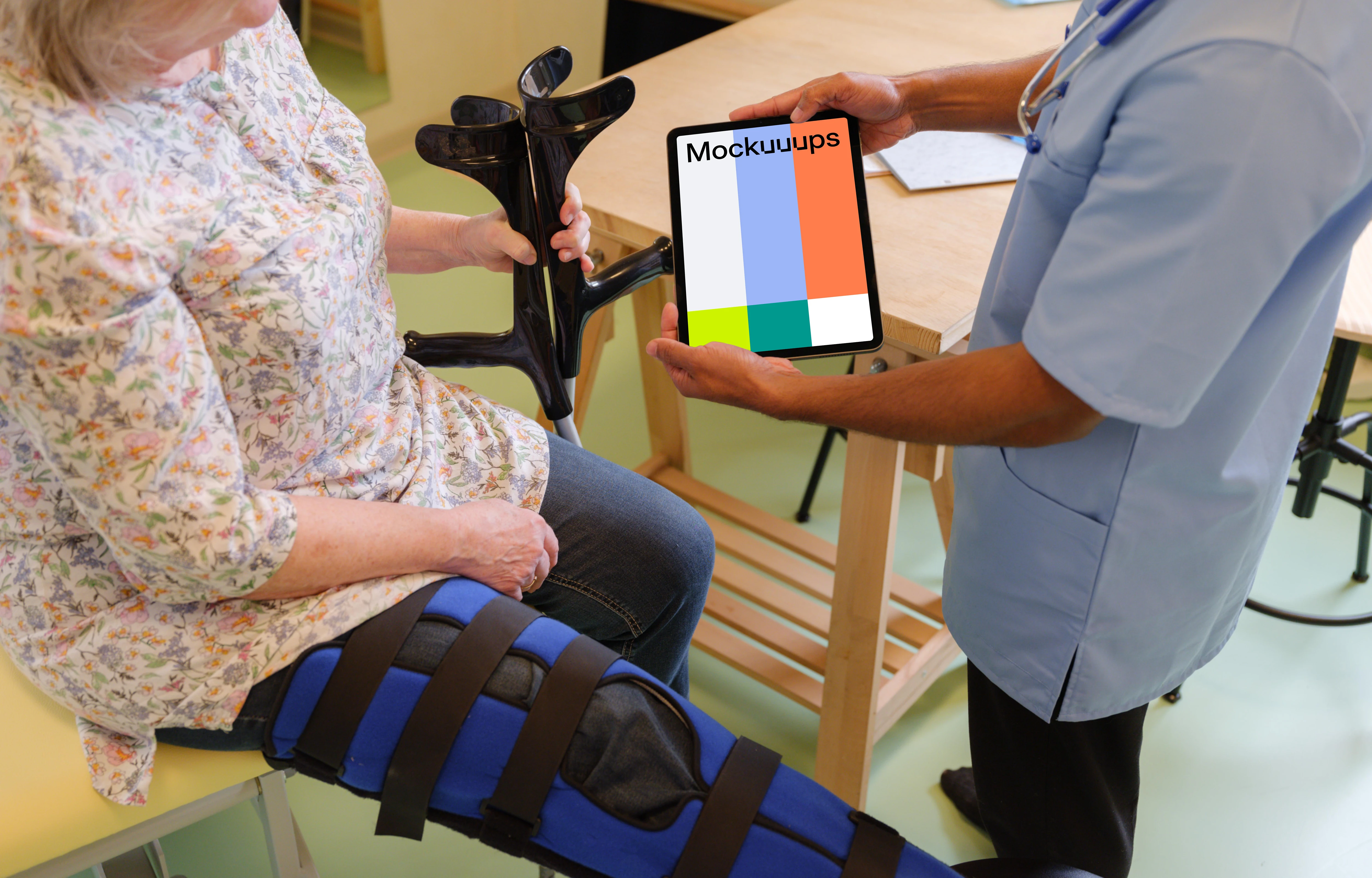 Male doctor holding an iPad mockup