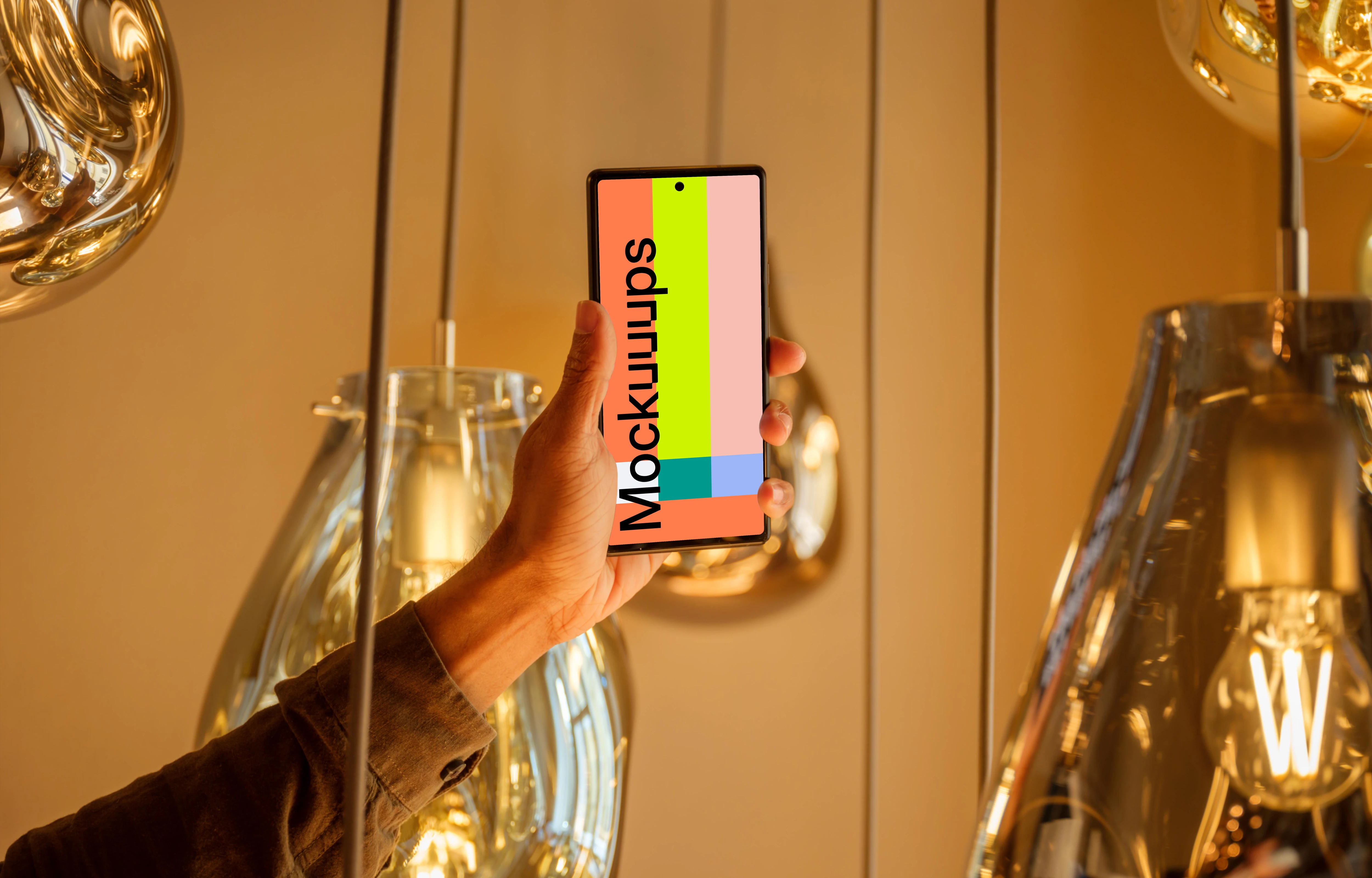 Male hand holding a Google Pixel mockup in the lounge