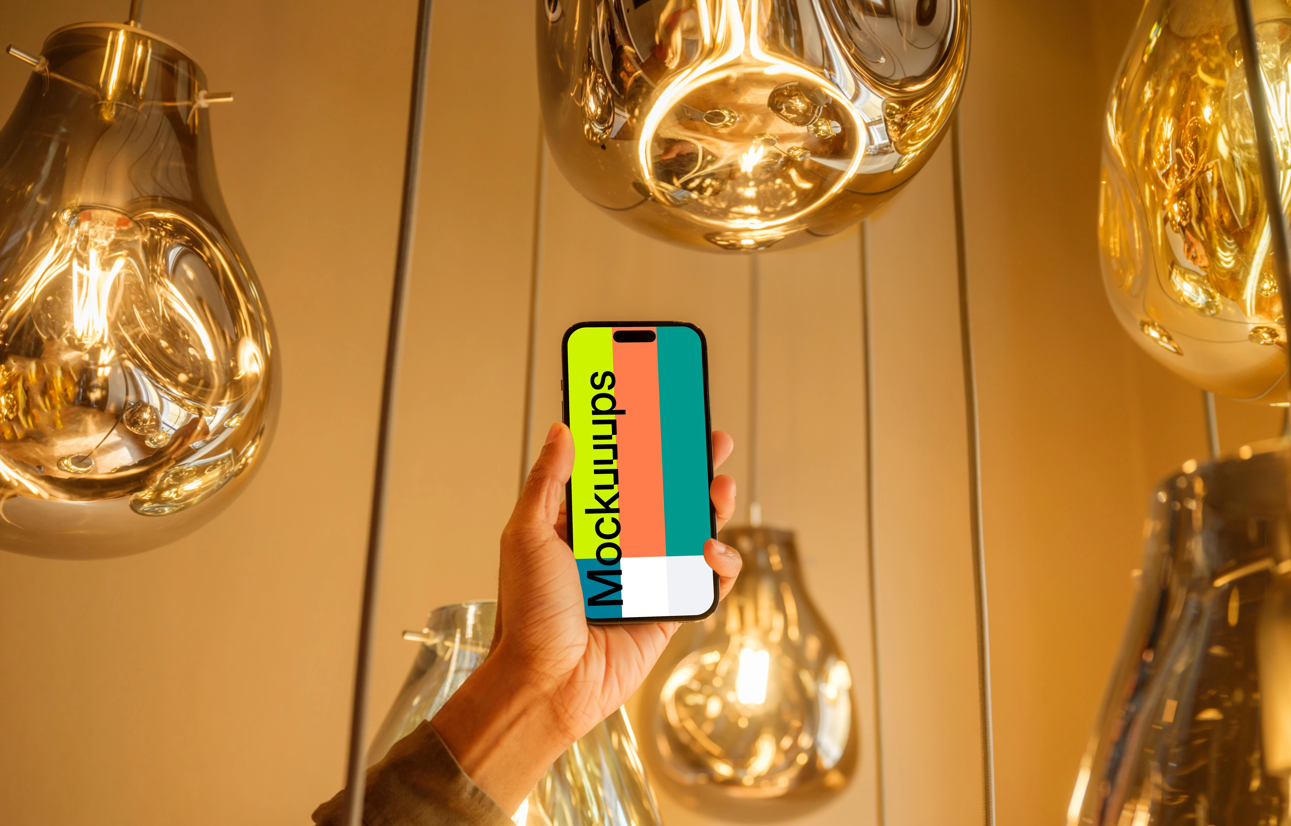 Male hand holding a iPhone mockup in the lounge