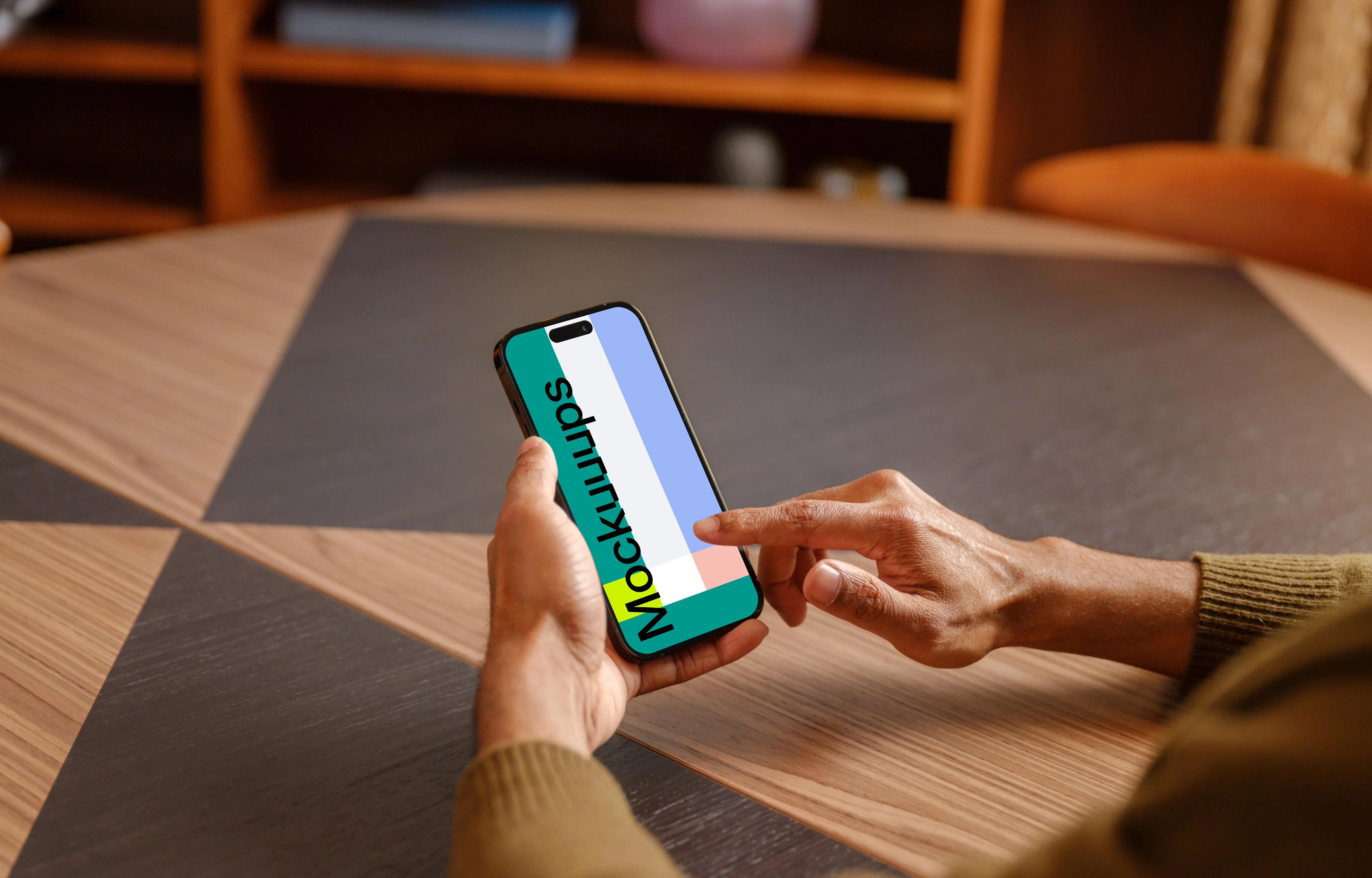 Male hand scrolling on the iPhone mockup