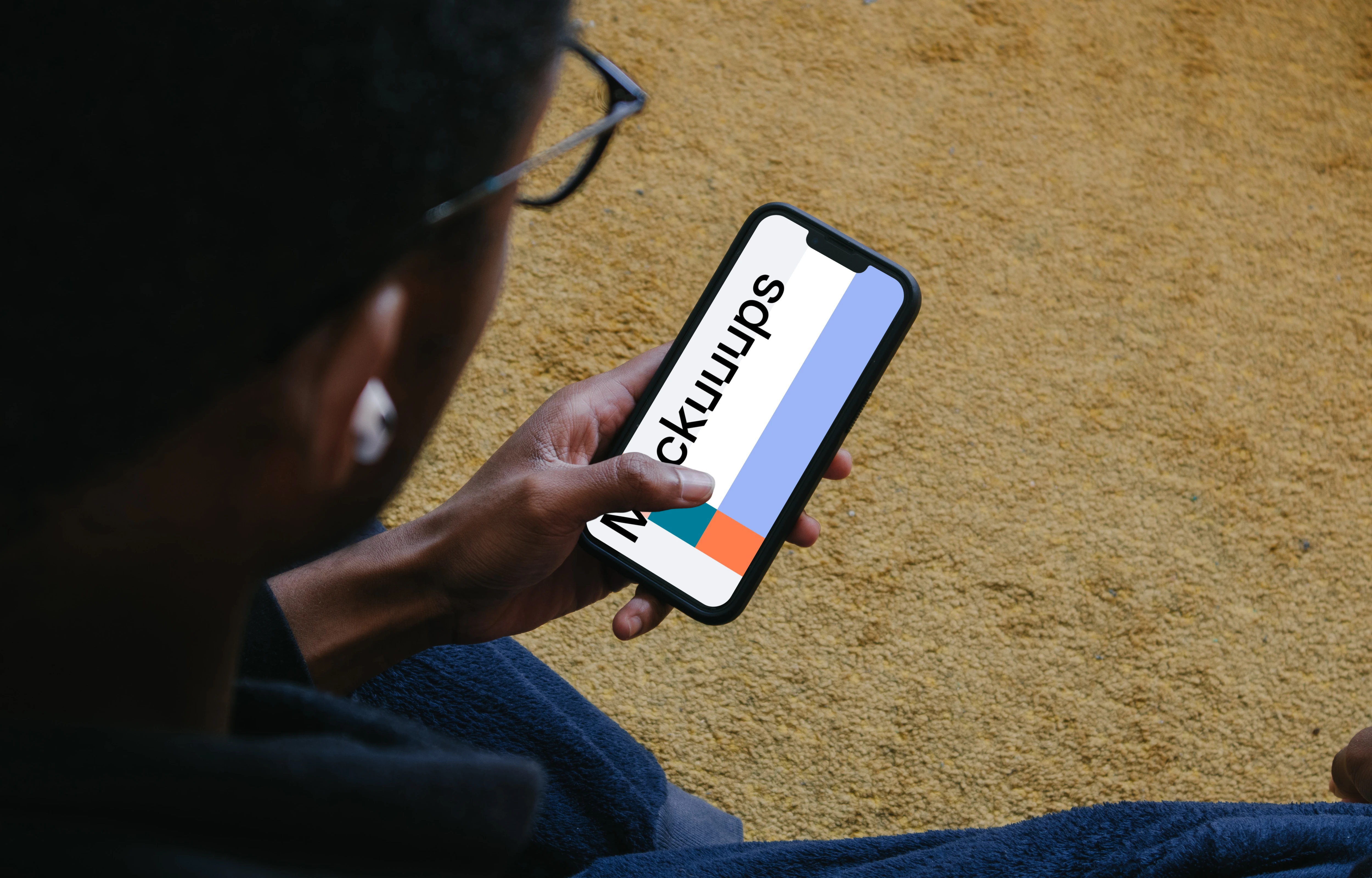 Male hand typing on iPhone mockup