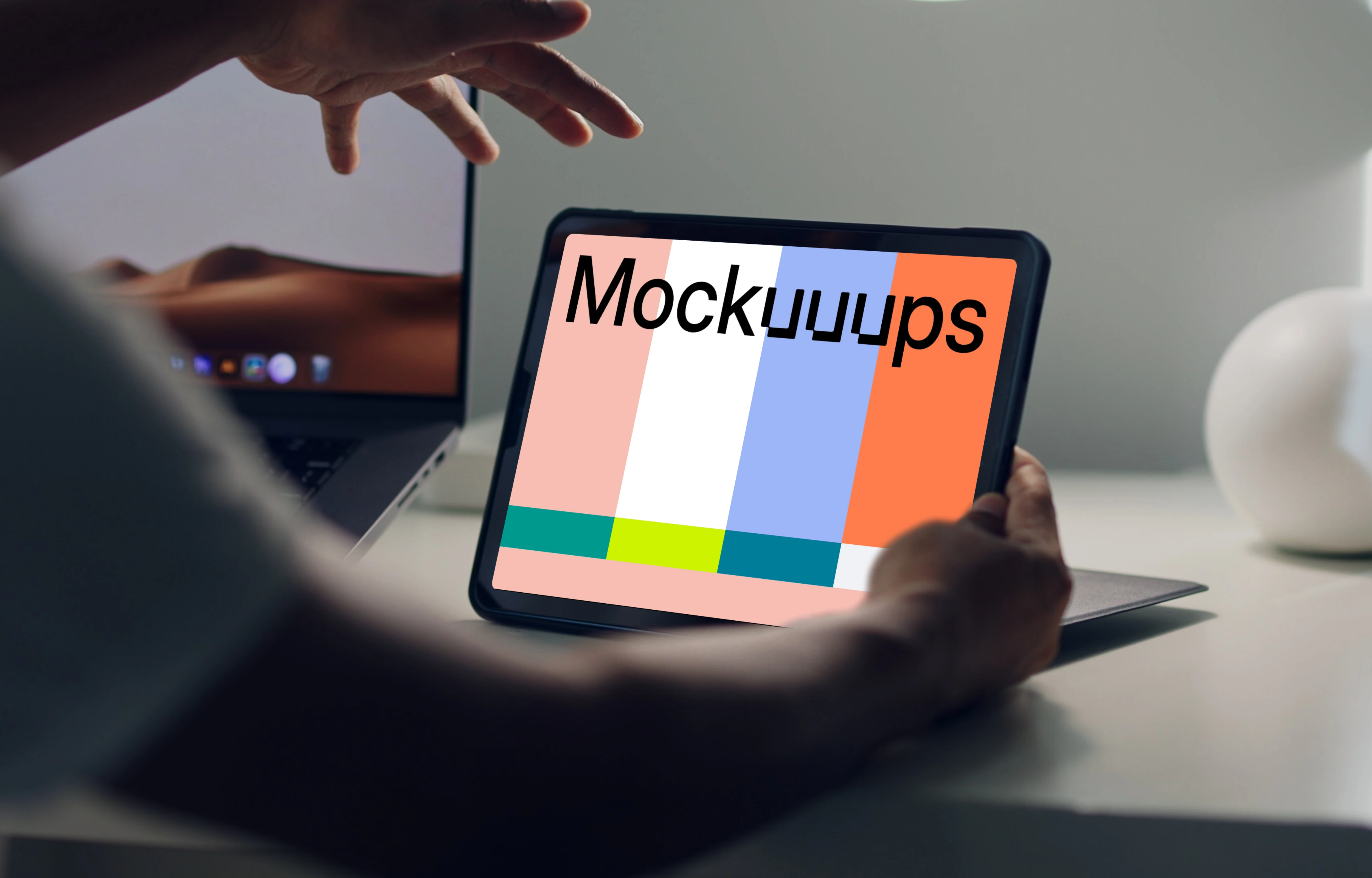 Male hands holding an iPad mockup stood on a table