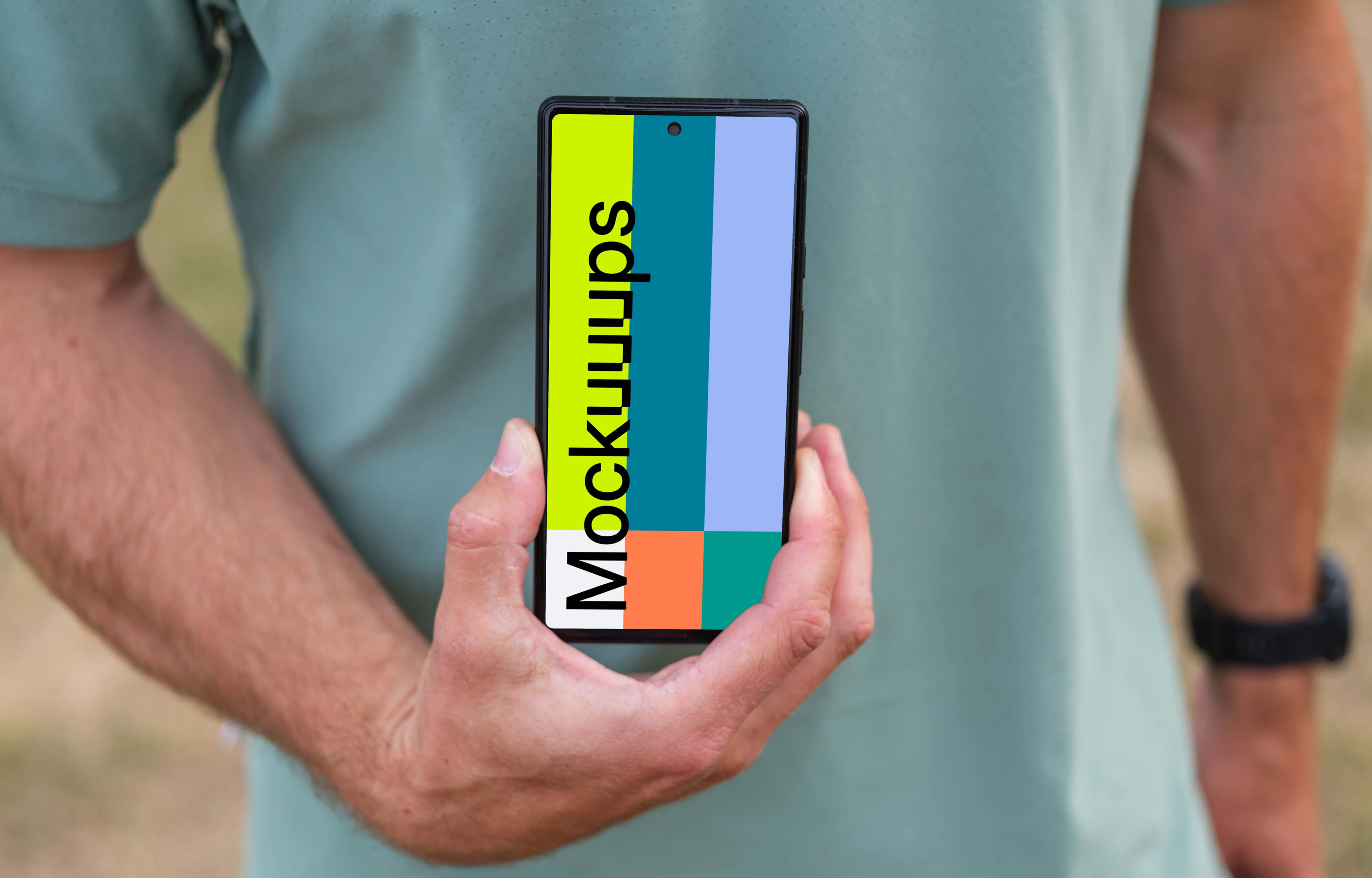Male trail runner holding a smartphone mockup