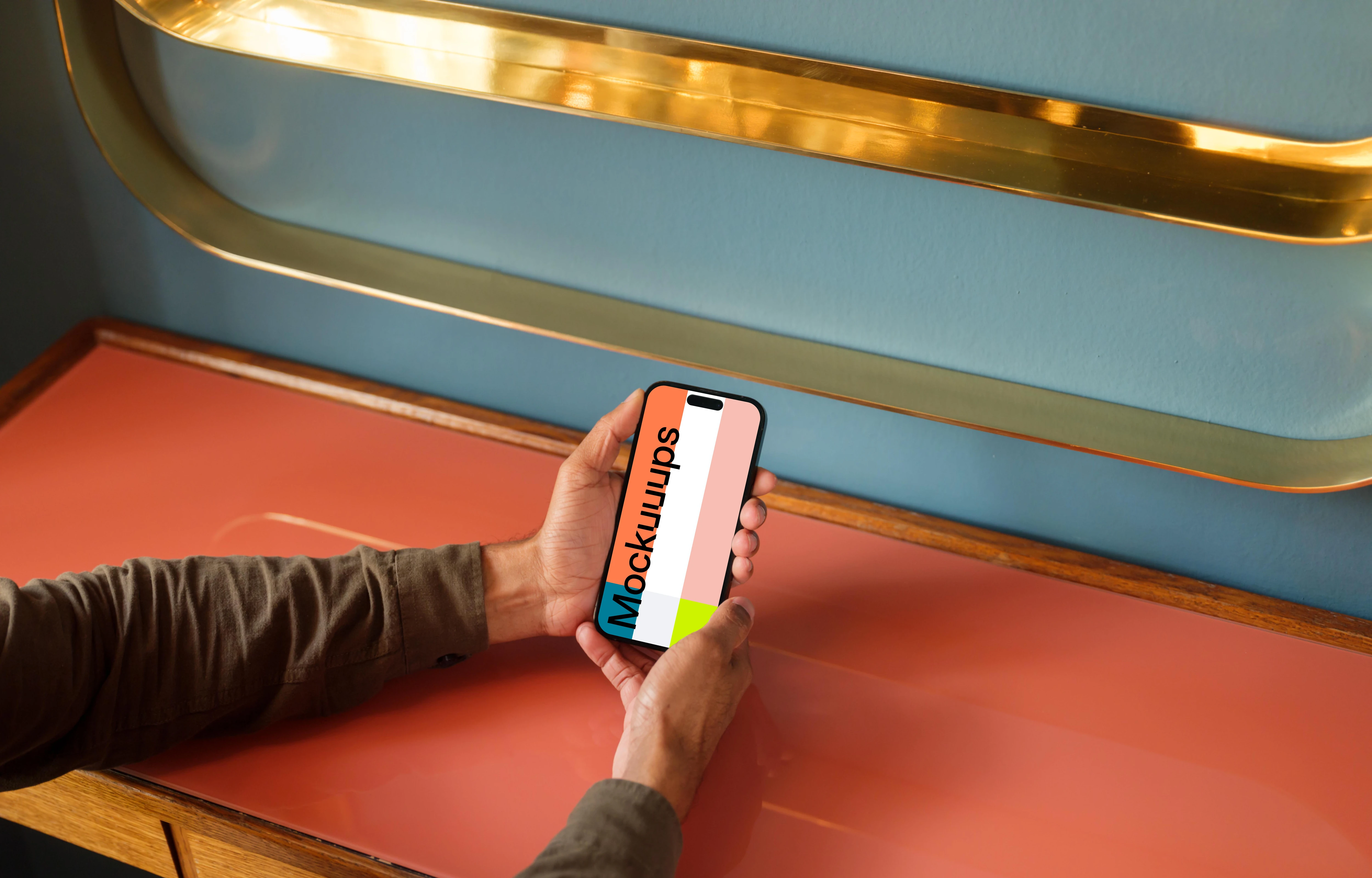 Man holding a phone in the lounge