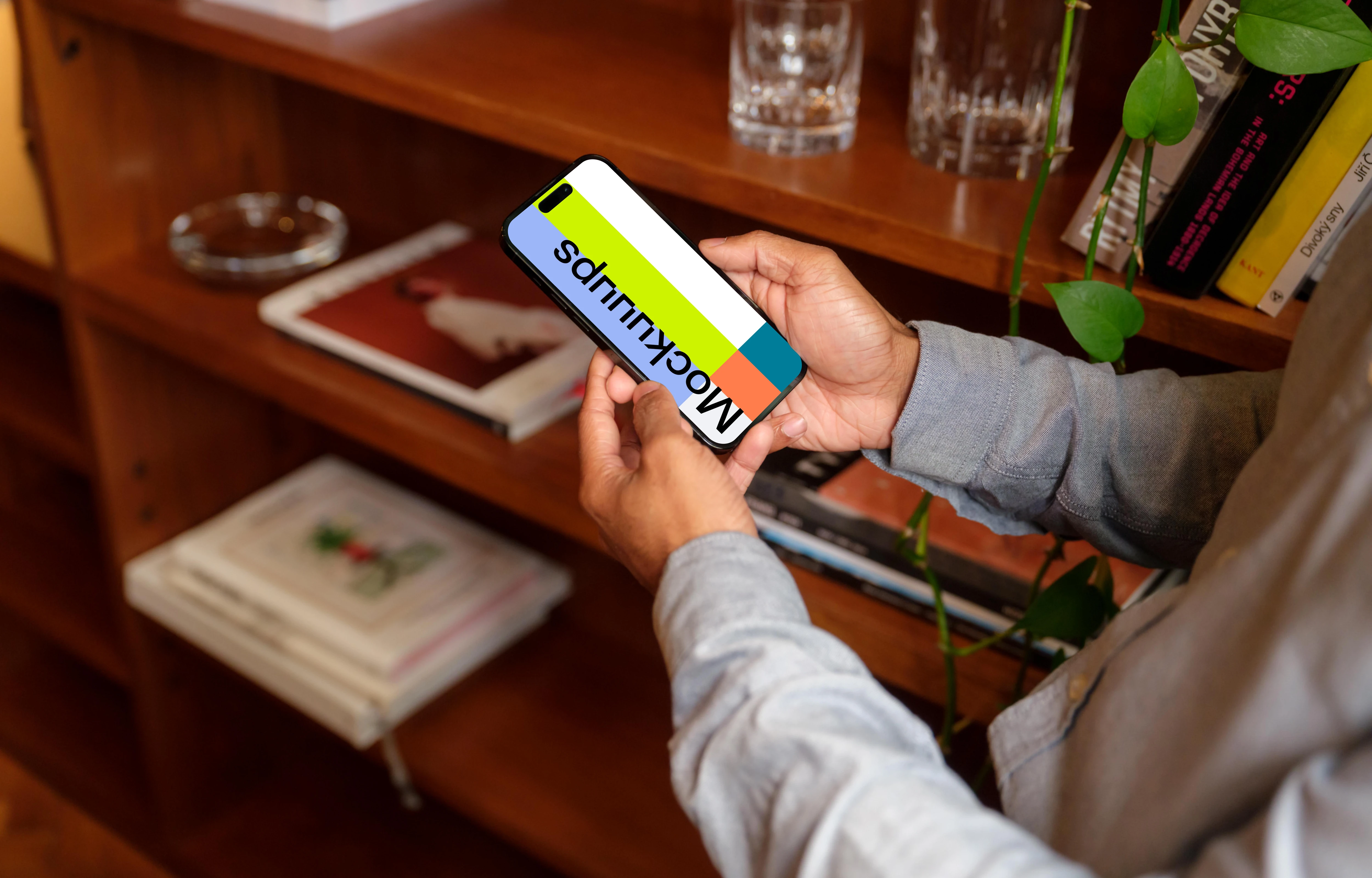 Man holding a phone mockup in the office
