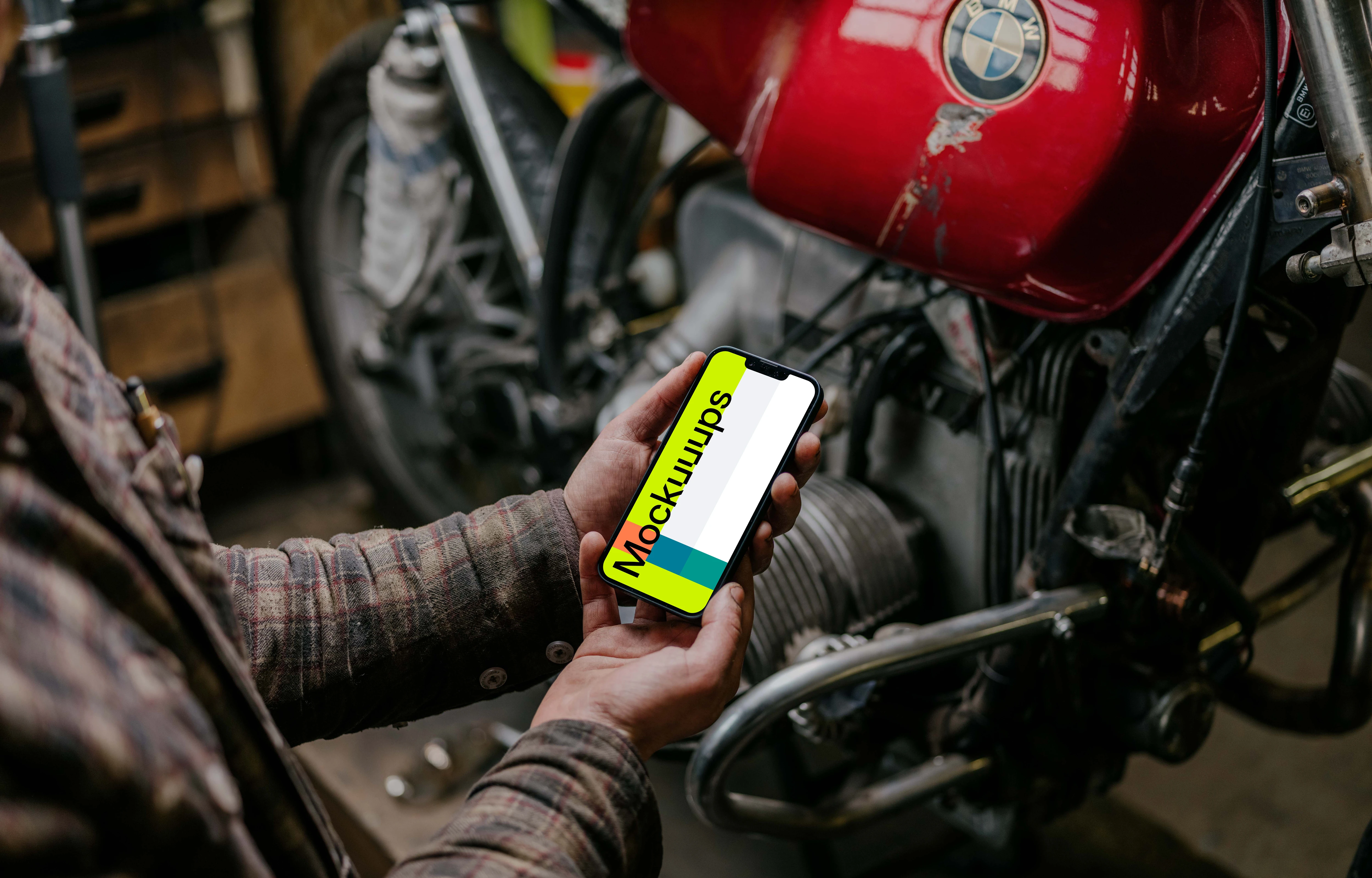 Man holding an iPhone 13 Pro mockup with both hands