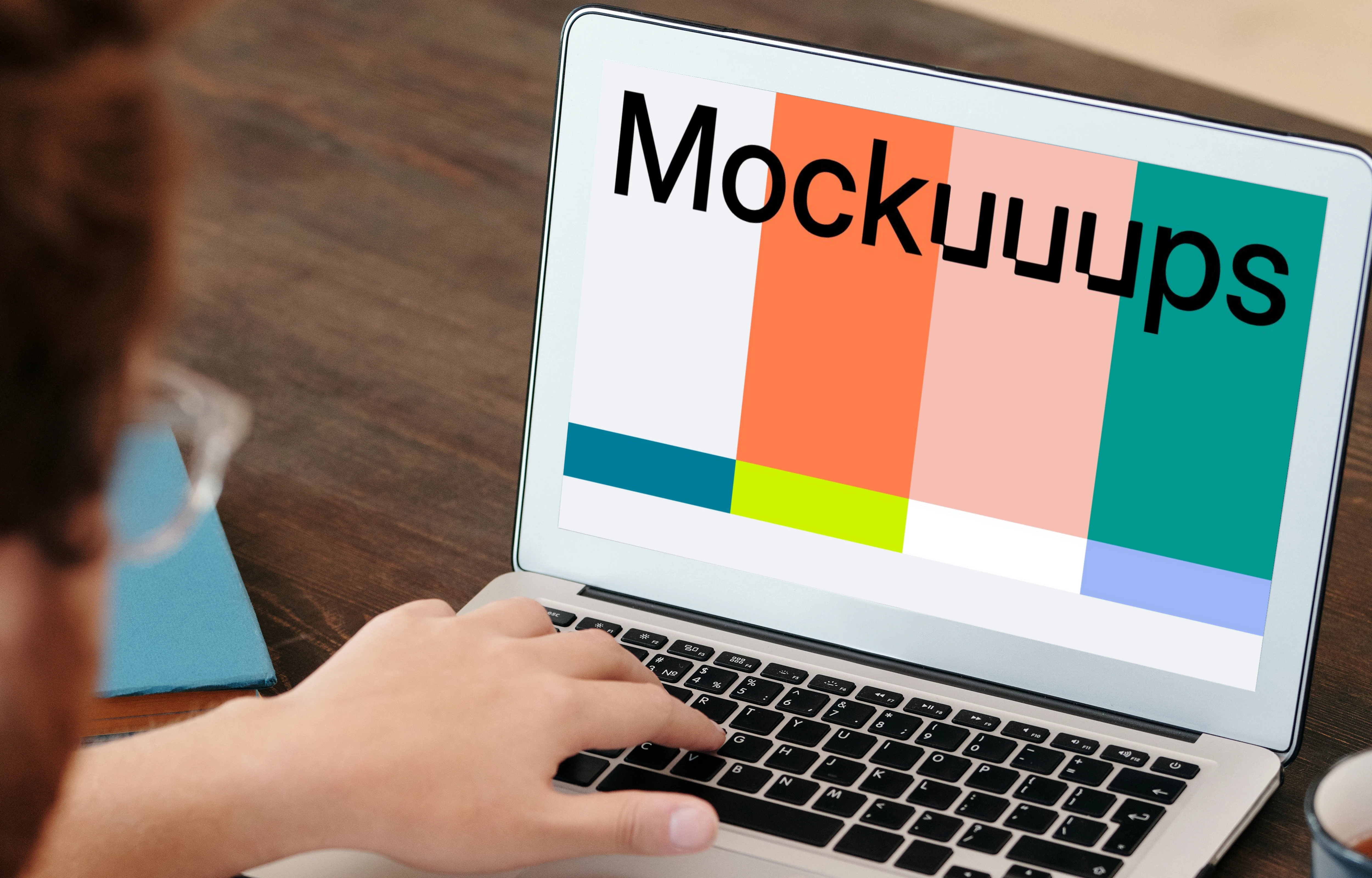 Man in glasses using a MacBook Air mockup