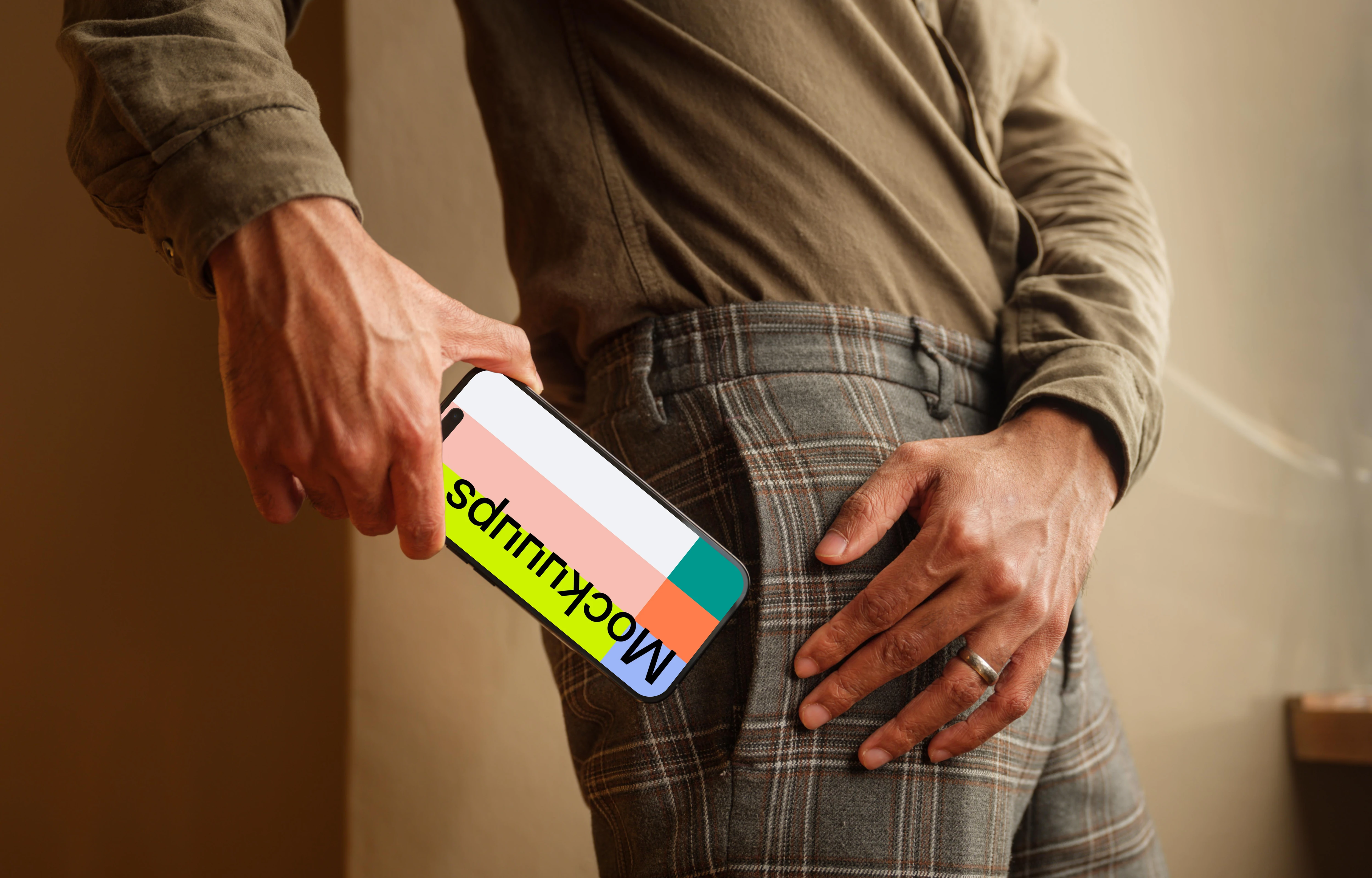 Man putting out of his pocket a iPhone mockup