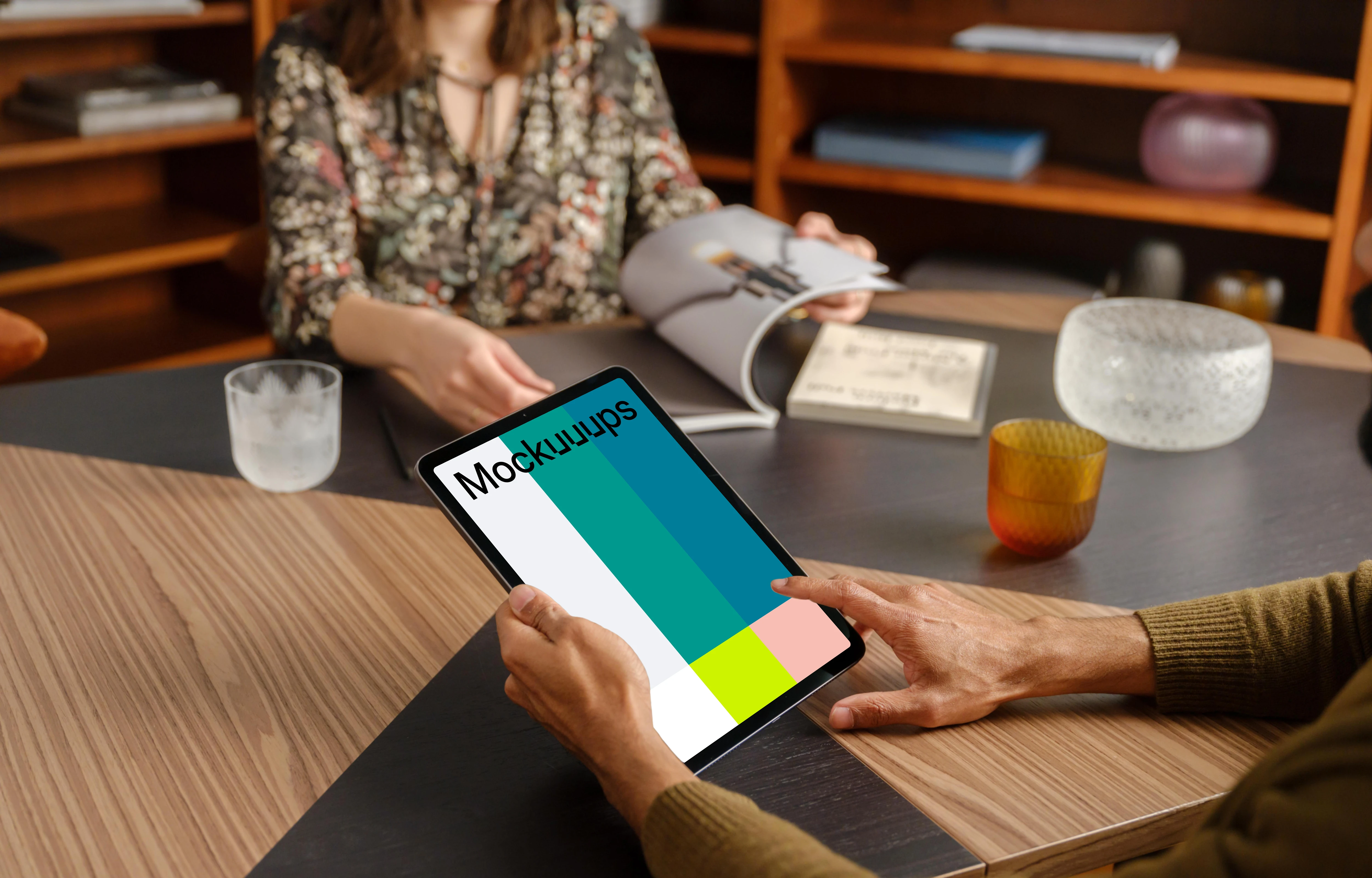 Man working on tablet mockup in the lounge