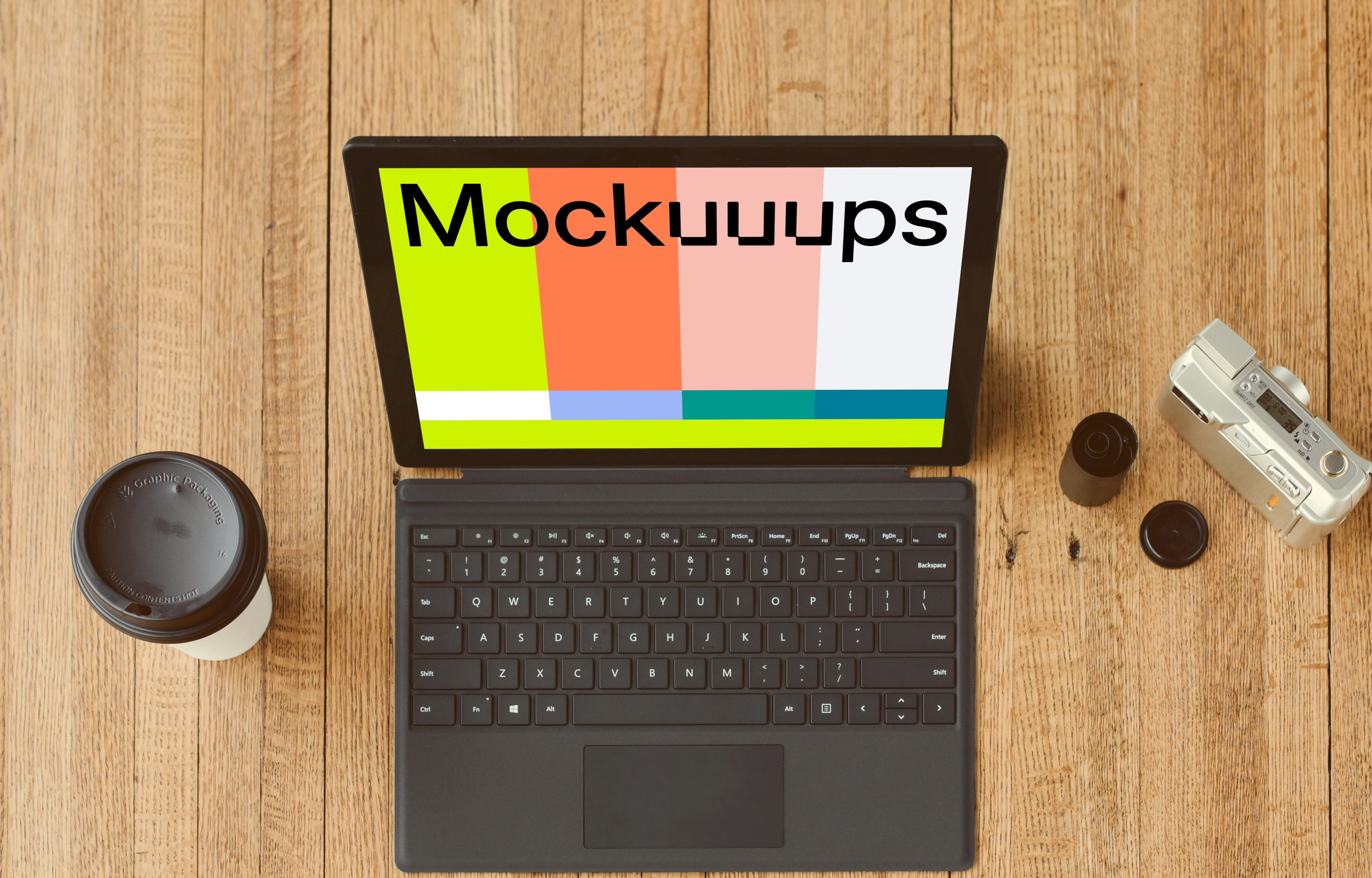 Microsoft Surface Laptop mockup beside a cup of coffee