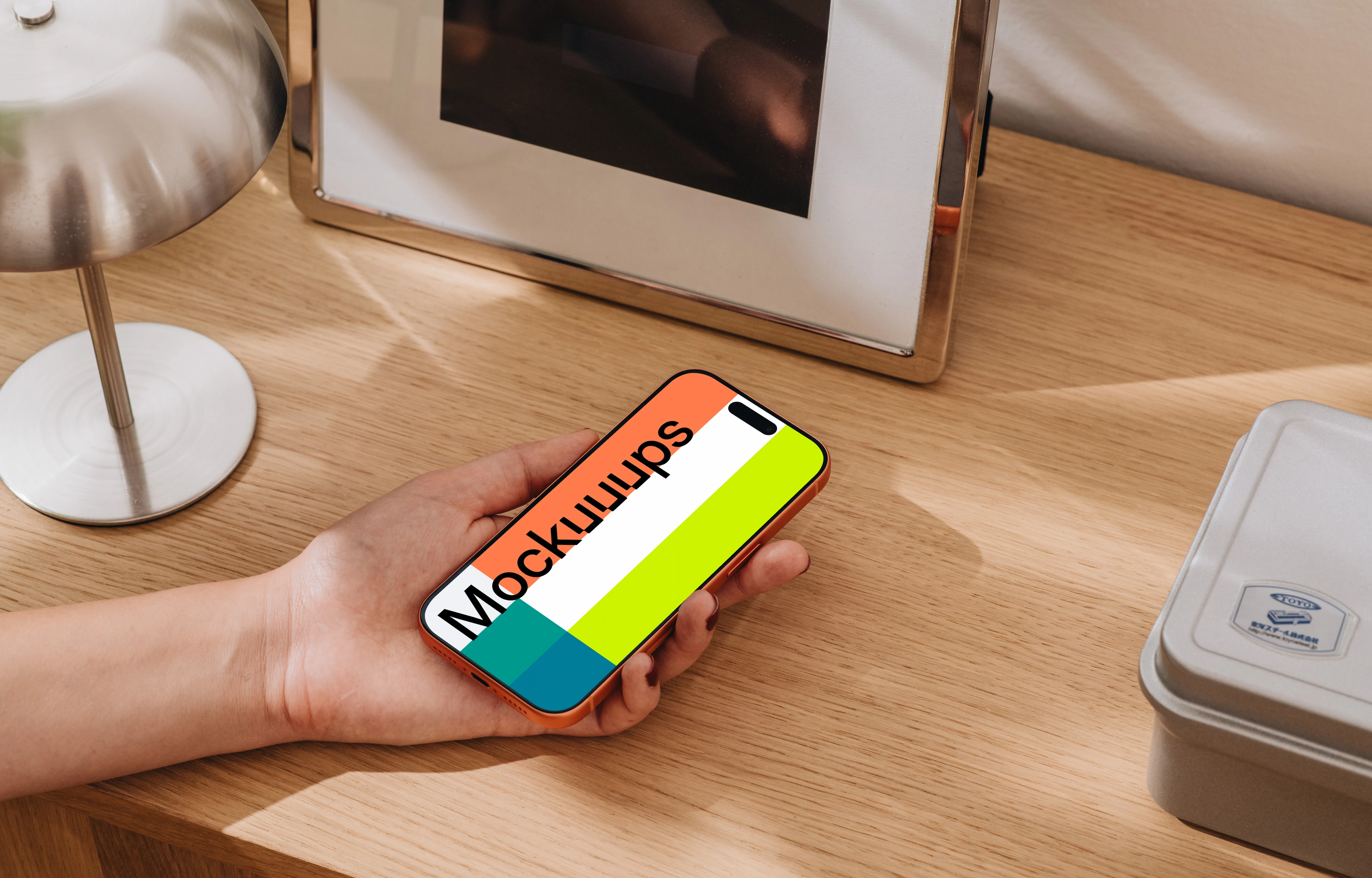 iPhone 17 Pro mockup on a wooden desk