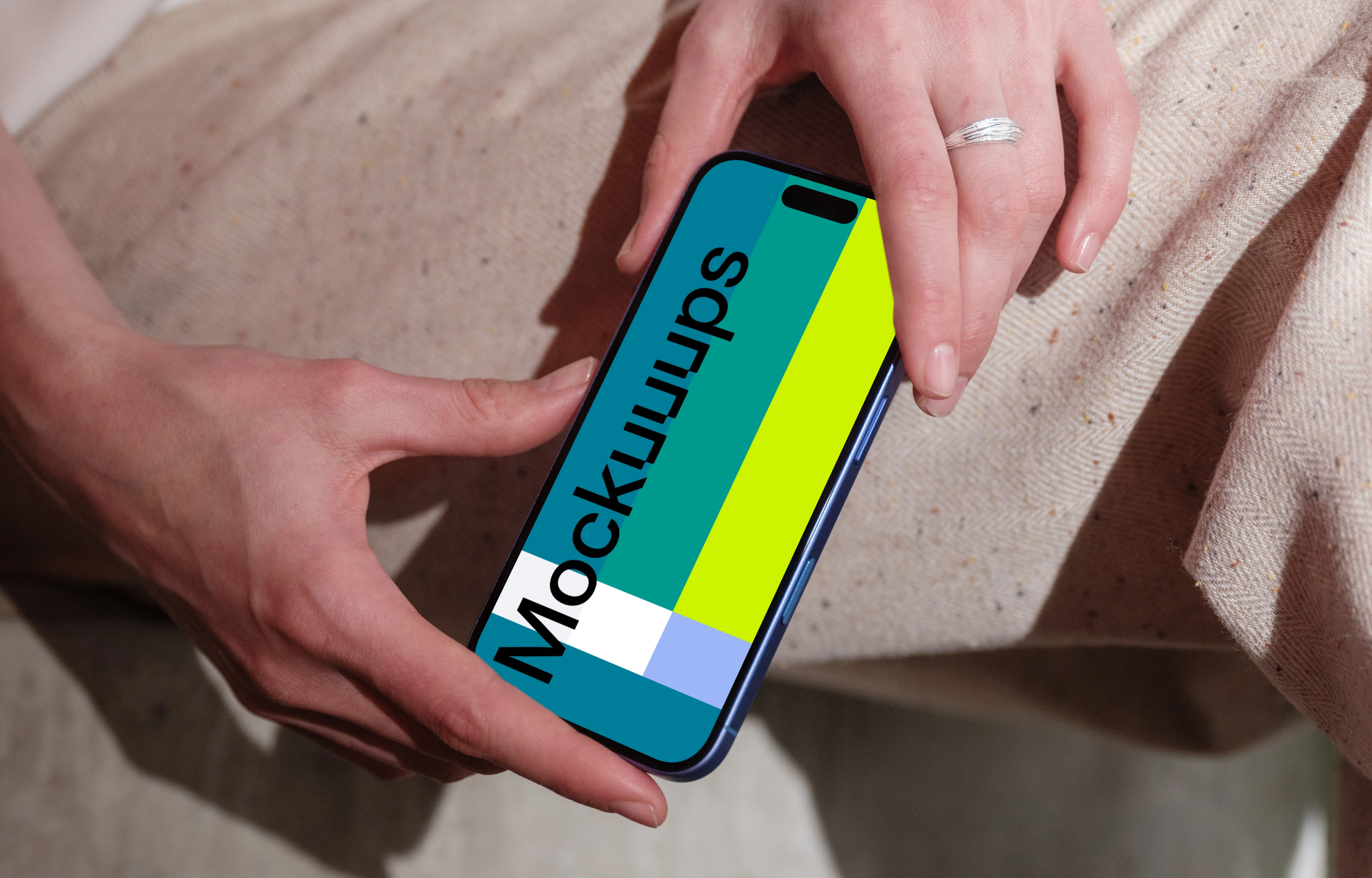 Woman holding iPhone 16