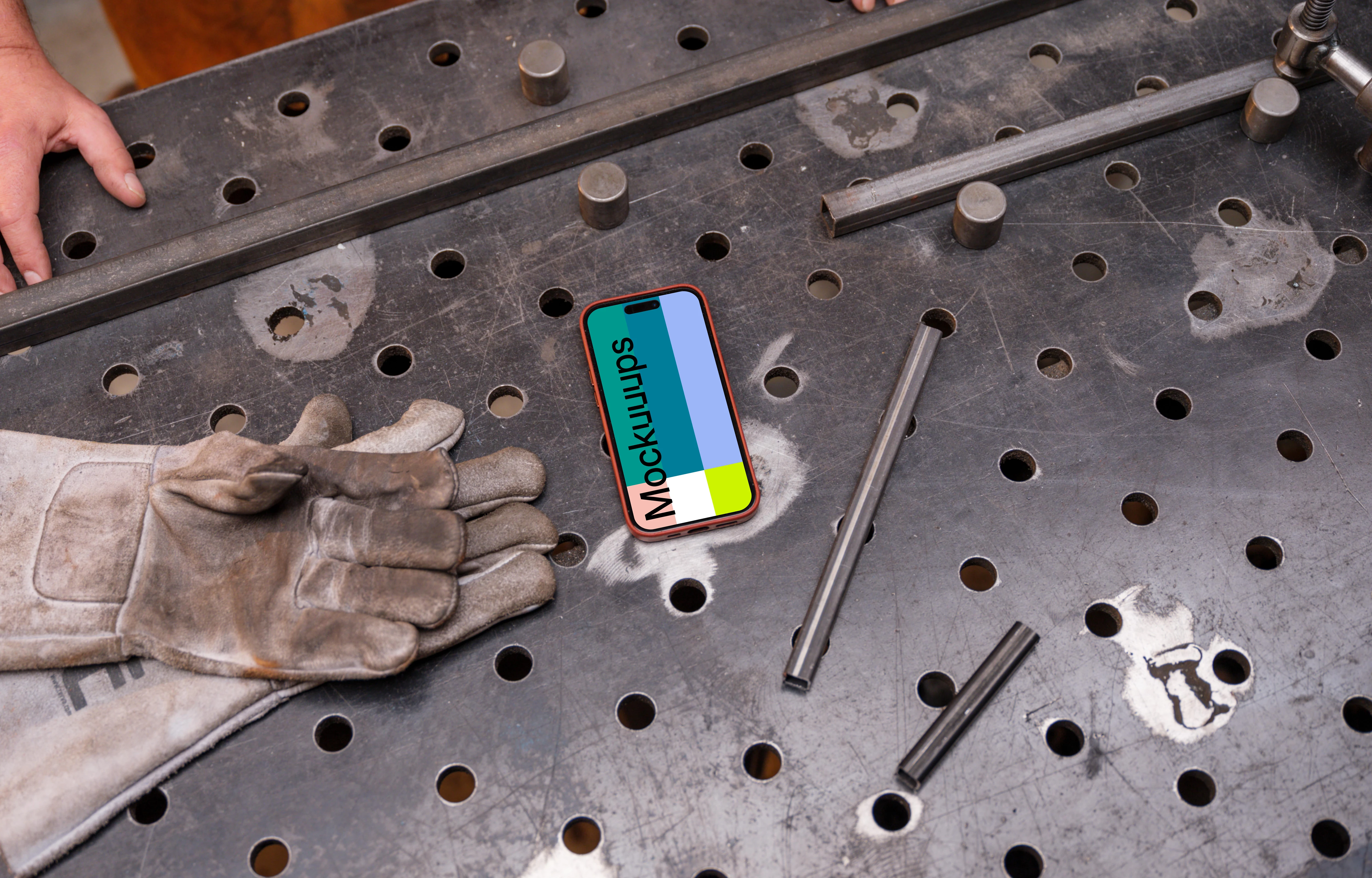 iPhone mockup placed on an iron table
